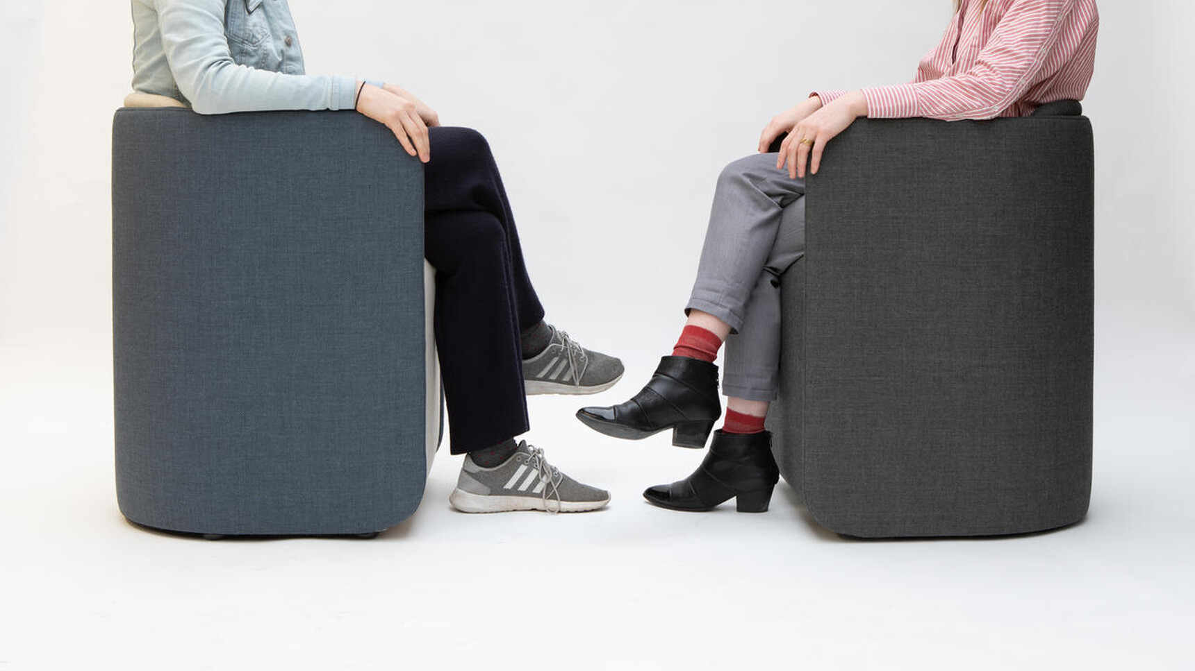 Two Buzzi Space BuzziDee Plus Meeting Chairs In Use Facing Each Other