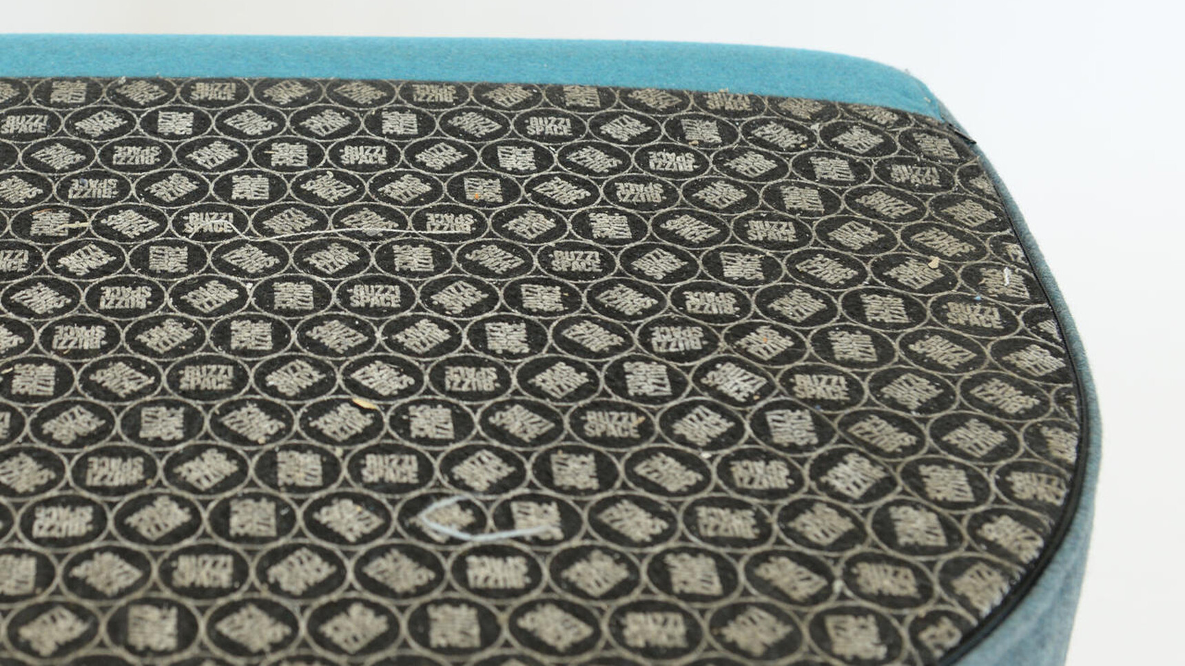 Buzzi Space BuzziDee Solo Pouffe 3D Rib Side Blue Upholstery Detail Image Showing Anti-Skid Base