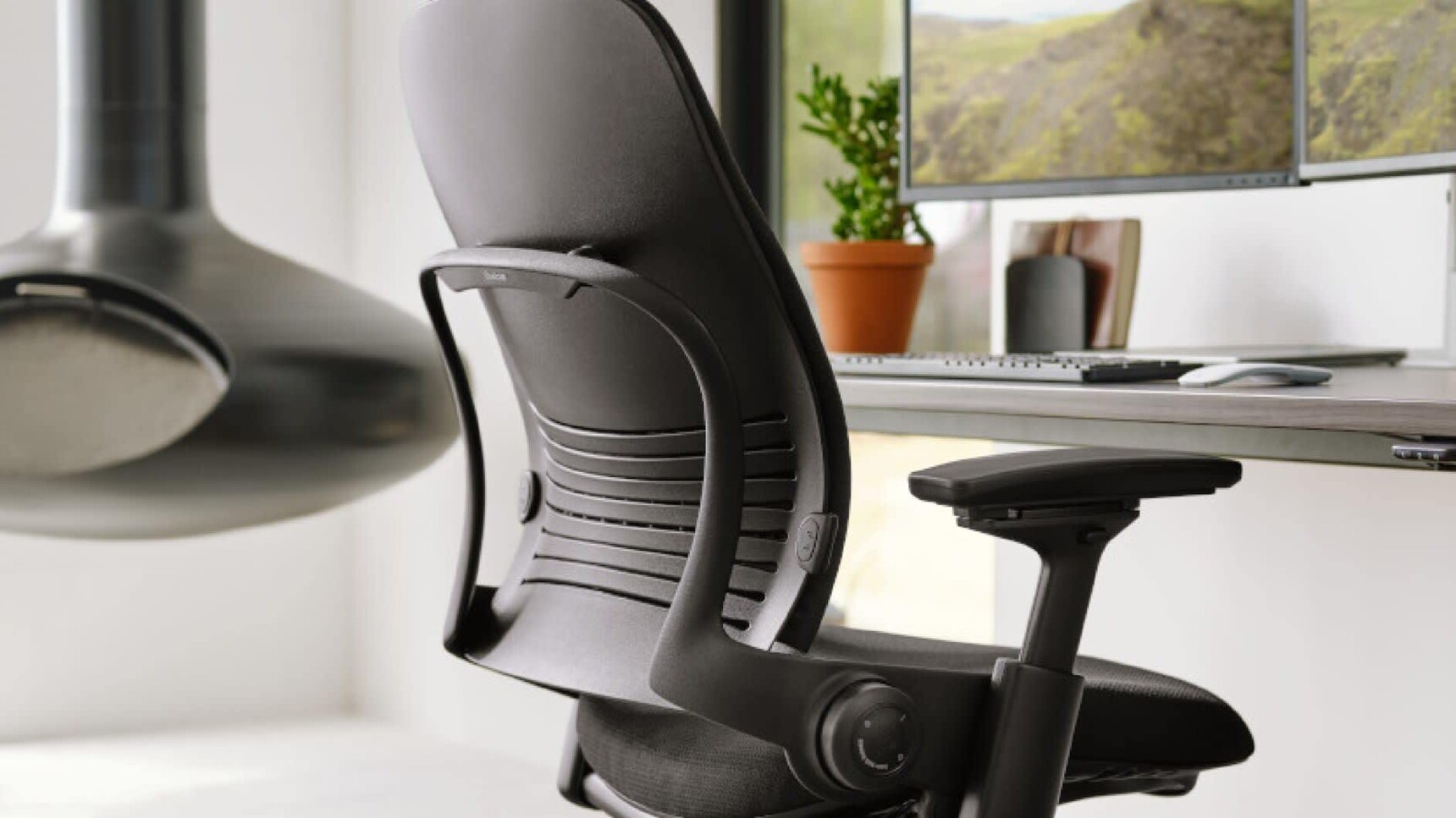 Steelcase Leap V2 Upholstered Office Chair At Desk Family Image