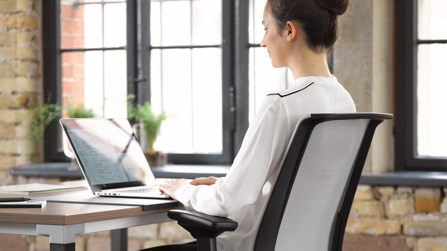 Steelcase Kalidro Fixed Height Desk In Office Environment Detail Image With Person At Desk