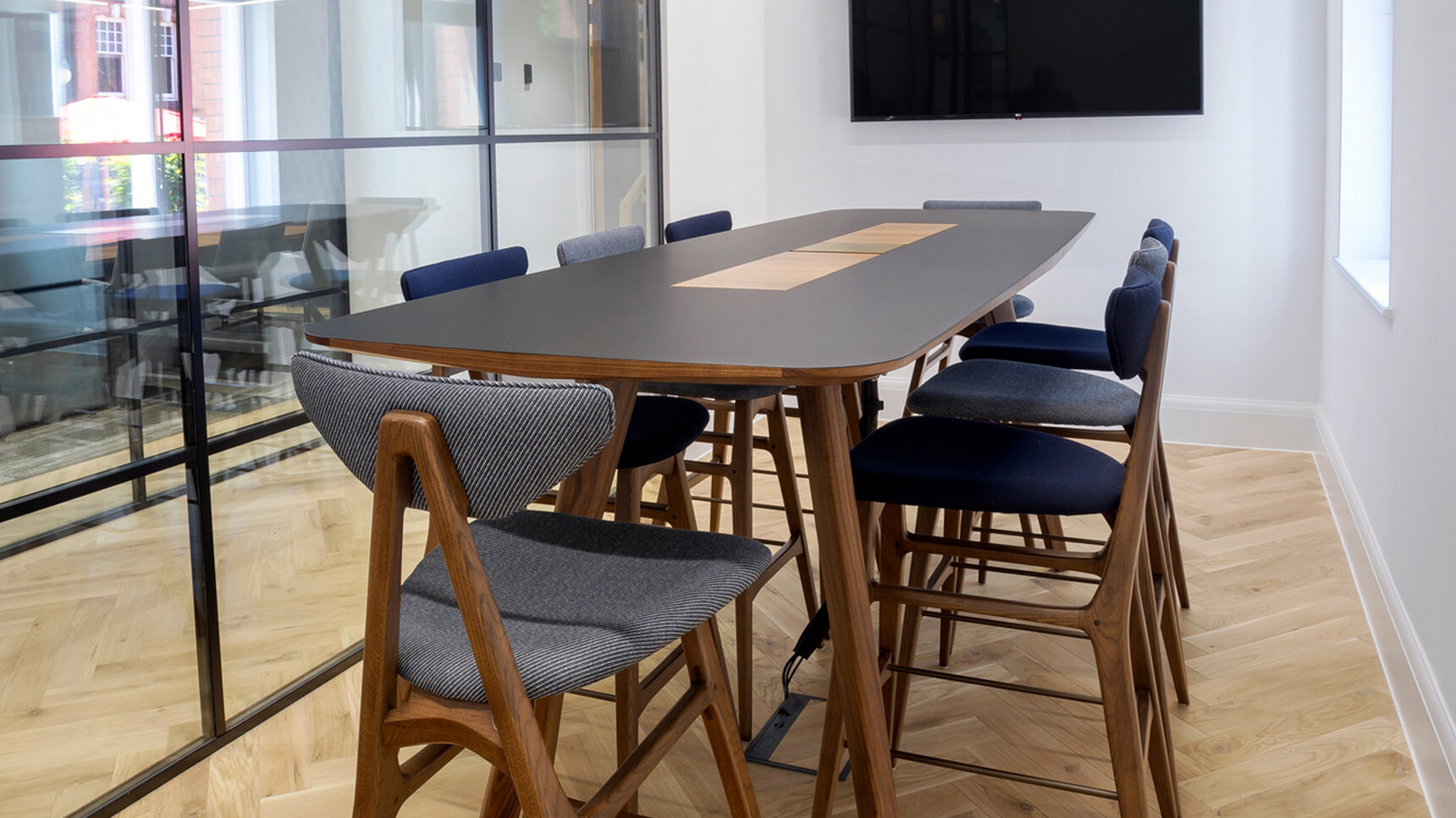 William Hands Vantage Poseur Height Meeting Table Black Top Wood Leg Detail Image In Office Setting