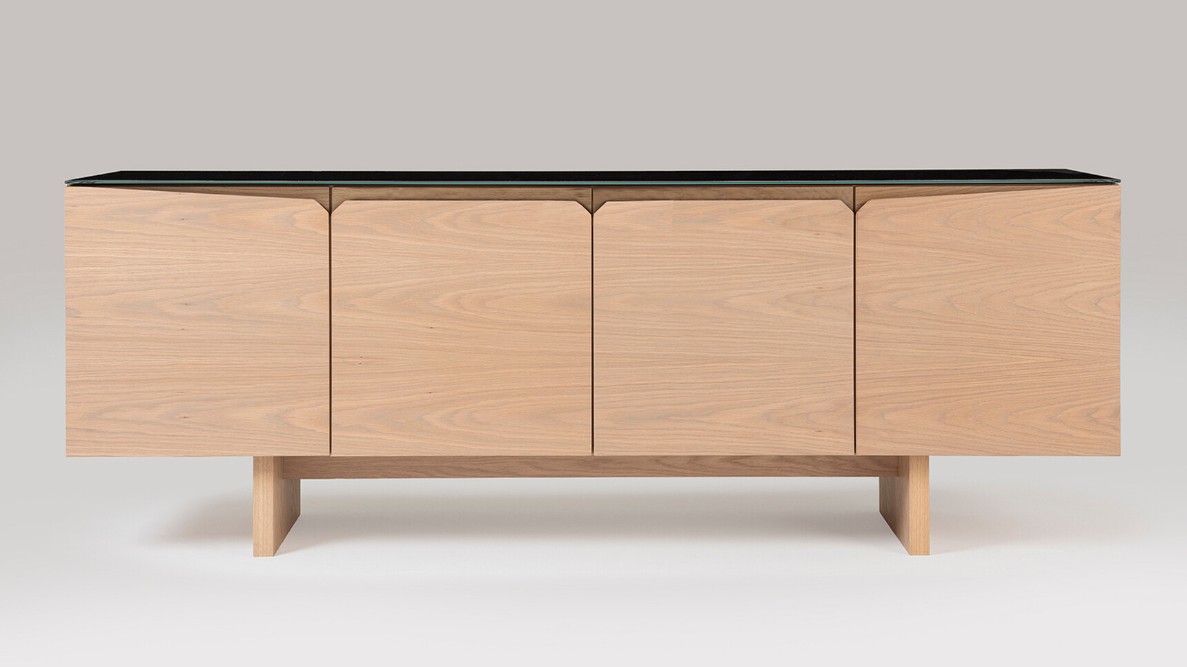 William Hands Vantage Credenza Slab Panel Base Four Doors Black Top Front Angle Family Image