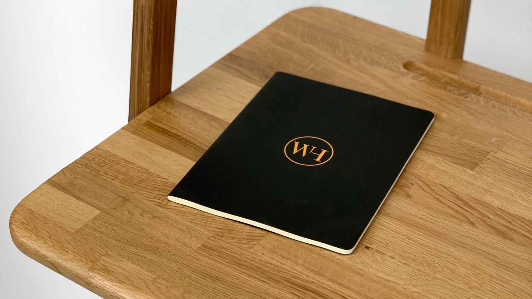 William Hands Embrace Home Office Desk Detail Image Of Notebook