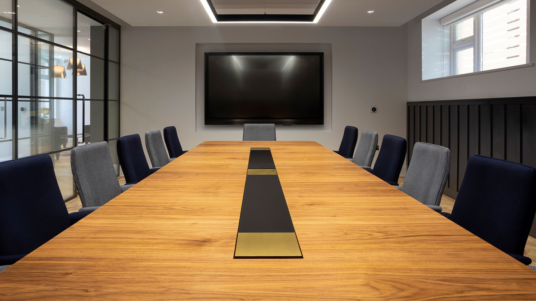 William Hands Cypher 841 Medium Back Office Chairs With Four Star Base Wing Arms At Table In Office Setting