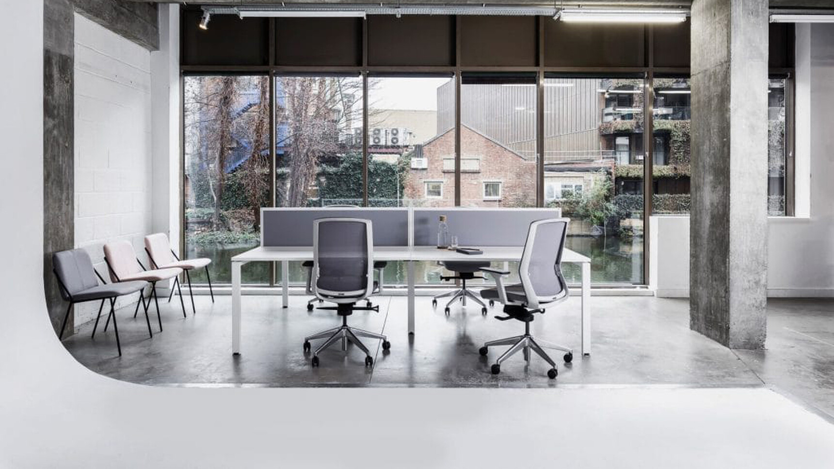 Workstories Rail Office Bench Desk Four Person Desk With Chairs At Desk In Office Environment