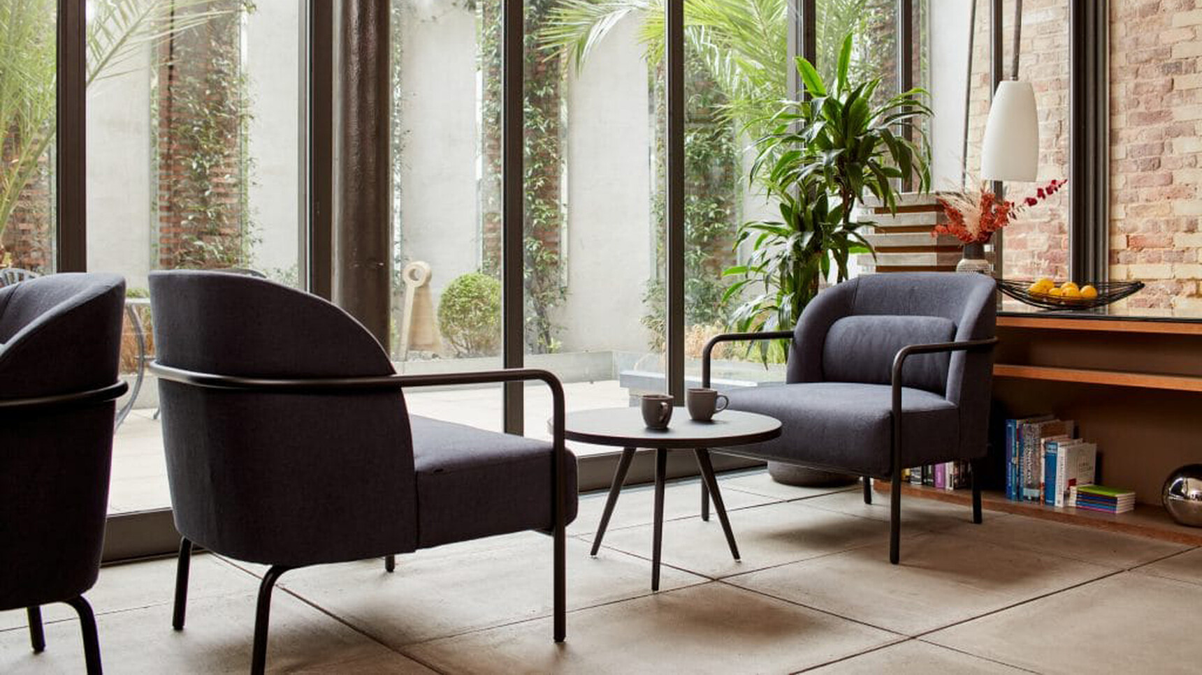 Workstories Air Circular Coffee Table In Lounge Setting