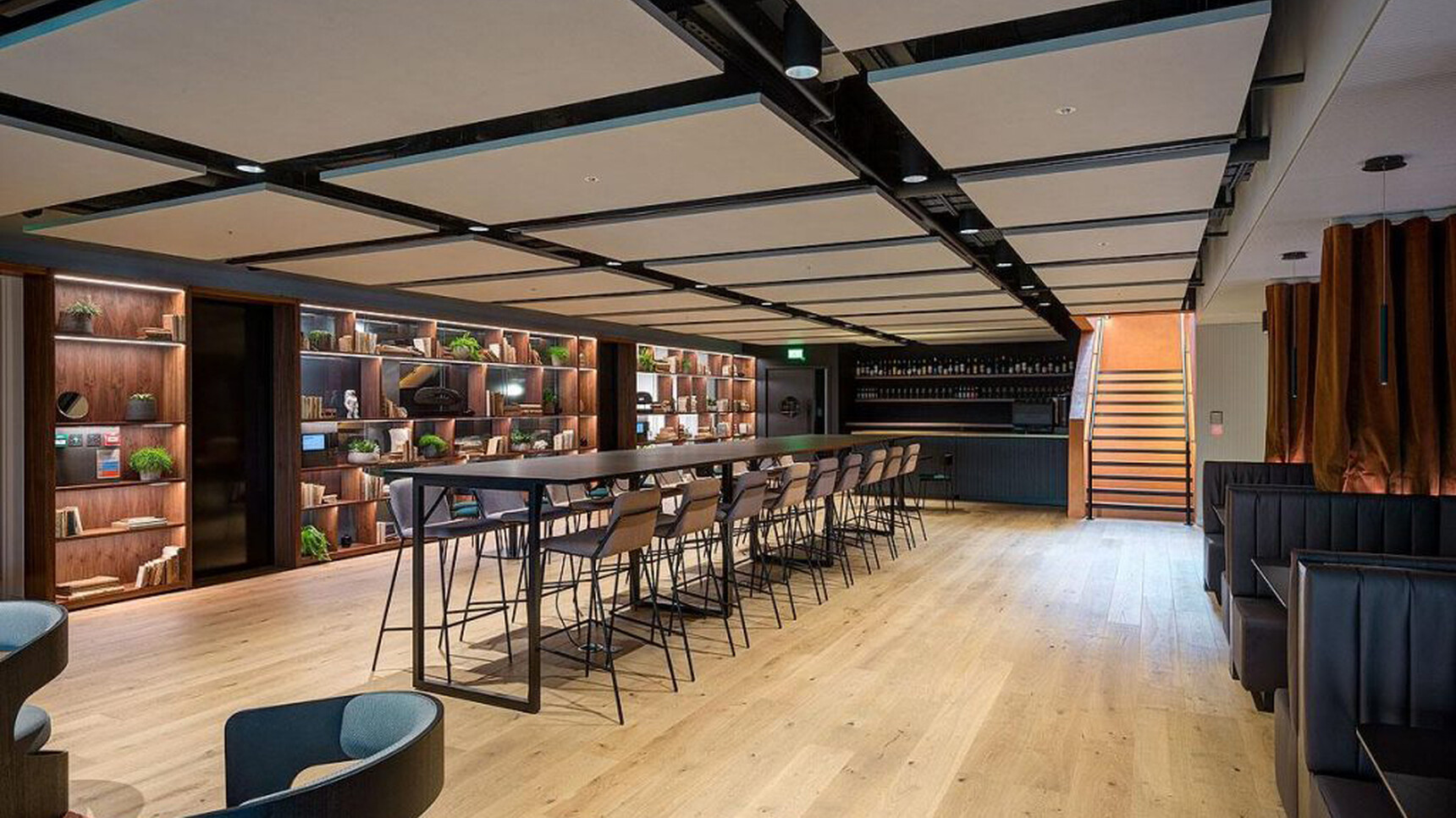 Workstories Sling High Upholstered Stool At Poseur Height Table In Office Setting