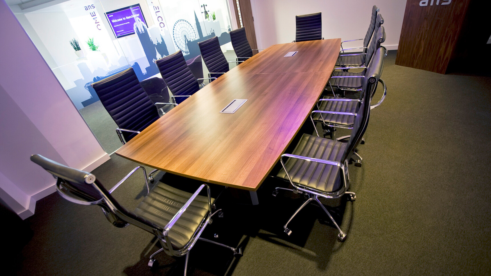 Elite Aerofoil Boardroom Table Two Section Top With Wood Finish Table Top And Legs With Black Leg Edges And Ten Elite Meeting Chairs In Boardroom