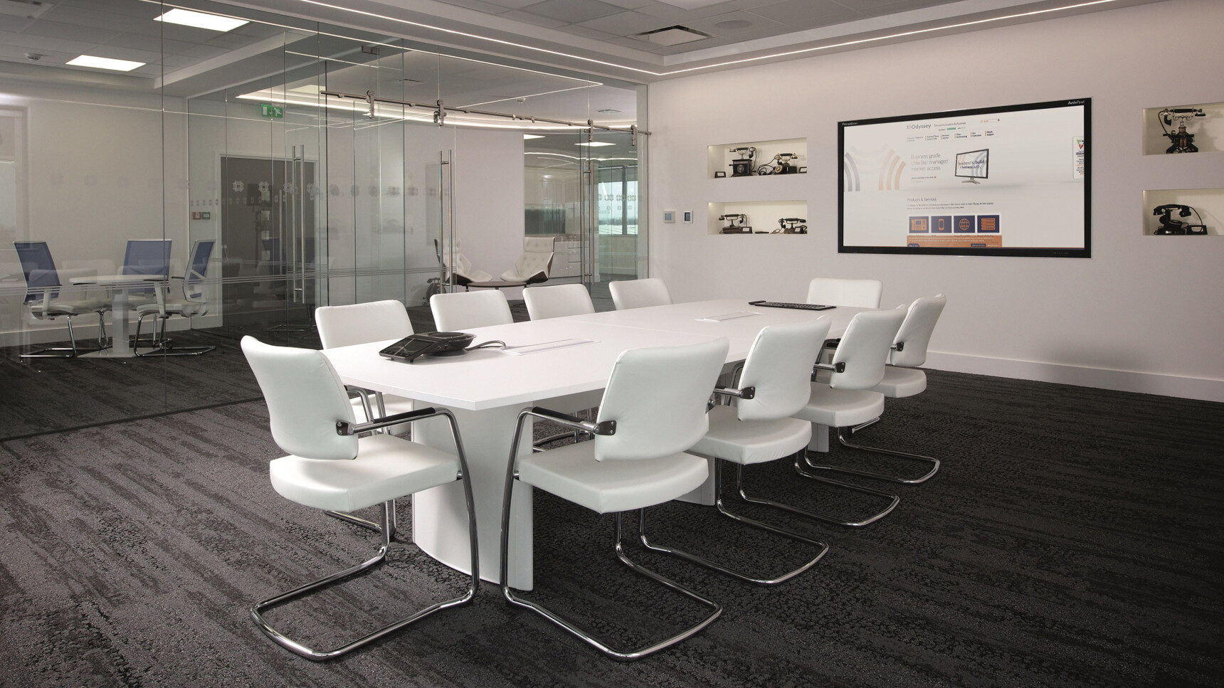 Elite Aerofoil Boardroom Table One Section Top With White Finish Table Top And Legs With White Leg Edges And Ten Moda Fully Upholstered Open Cantilever Base Meeting Chair With White Upholstery With Polished Chrome