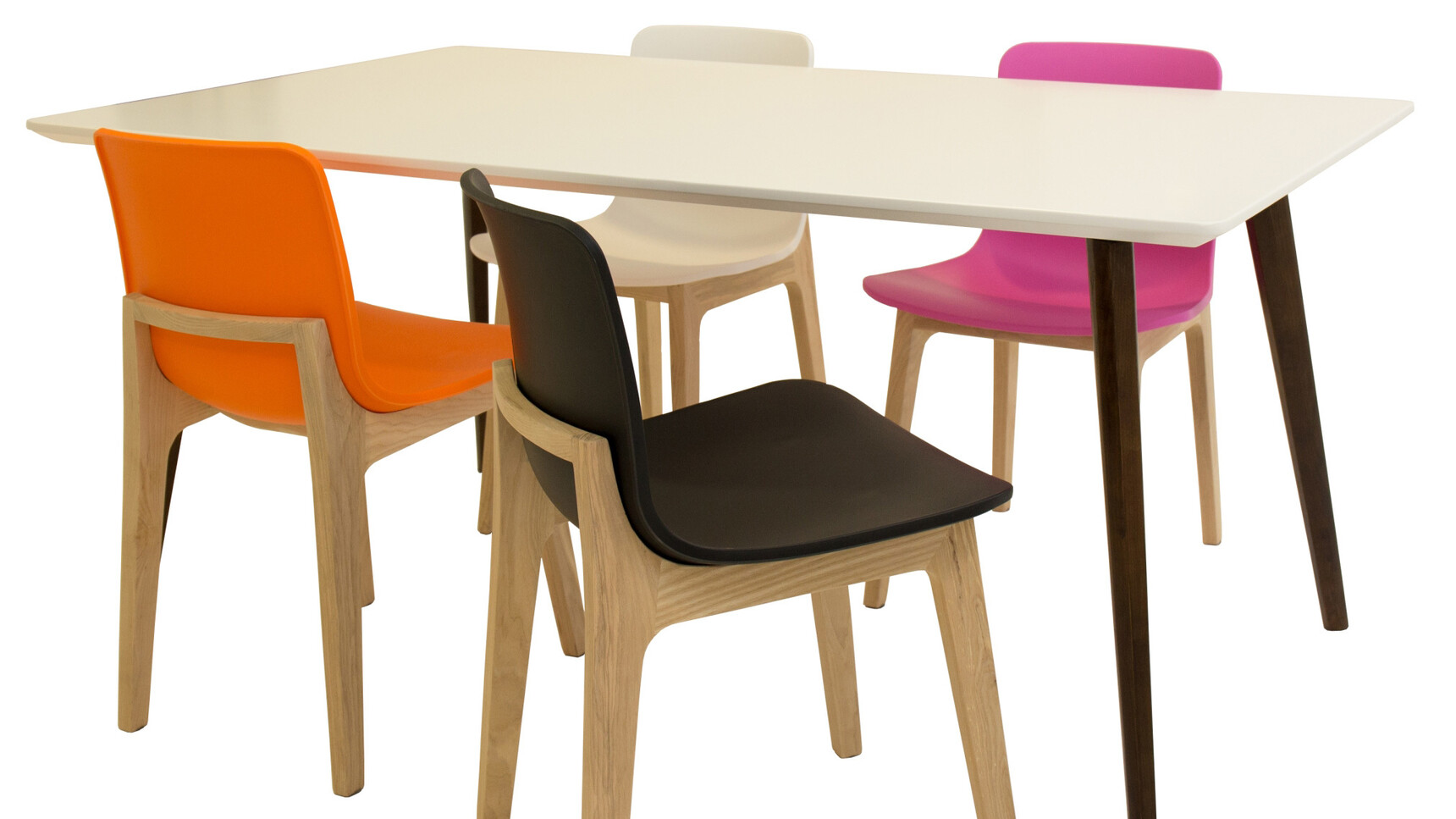Four Elite Bill Chairs With Plastic Seat And Backrest In Black Pink Orange And White At Piazza Rectangular Meeting Table With White Table Top And Brown Leg Base