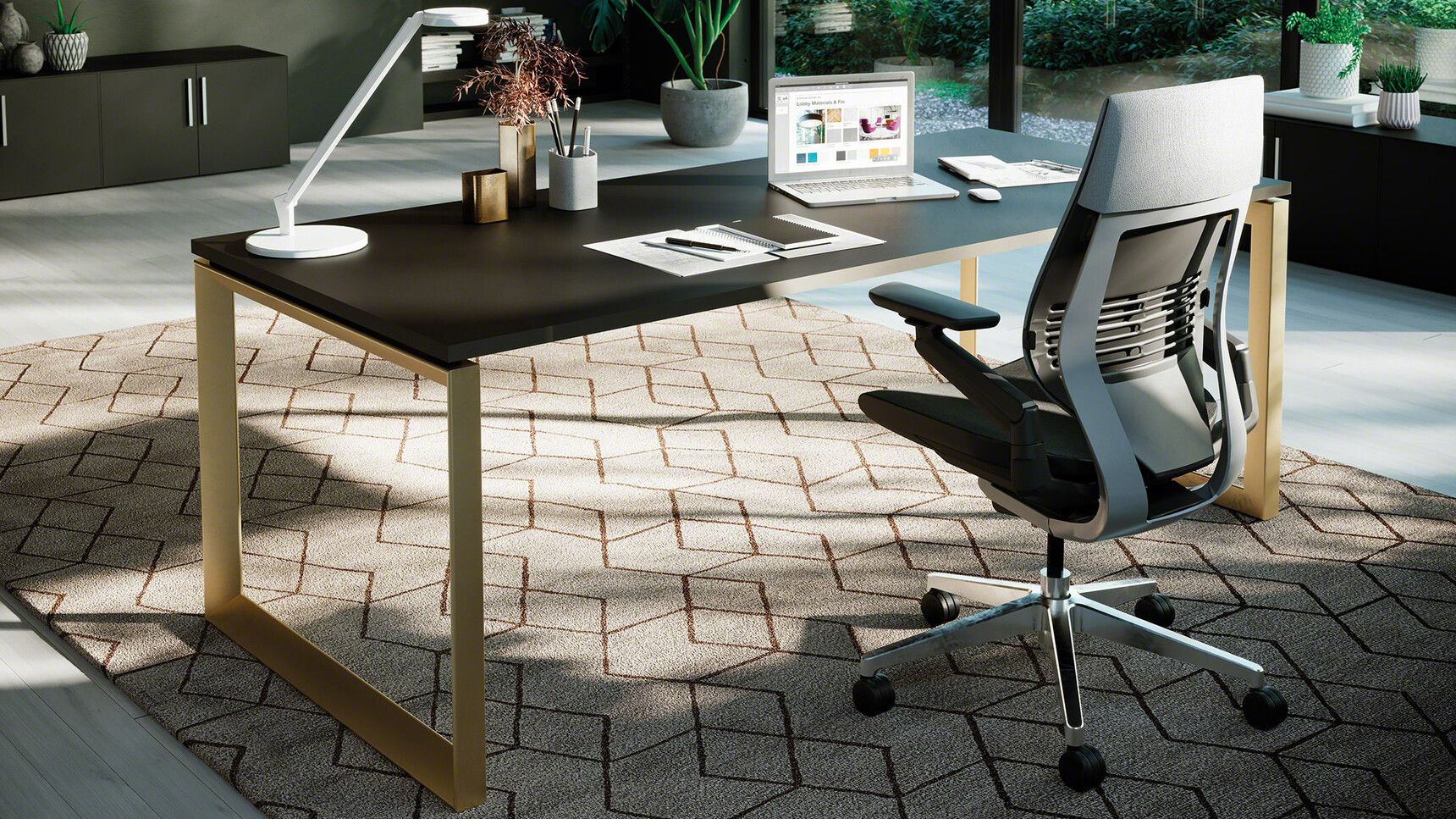 Steelcase Frameone Loop Leg Desk With Black Table Top Finish And Gold Loop Leg Finish With Gesture Wrapped Back Office Chair With Black Upholstery And Black Dark Grey Frame And Polished Aluminium Base