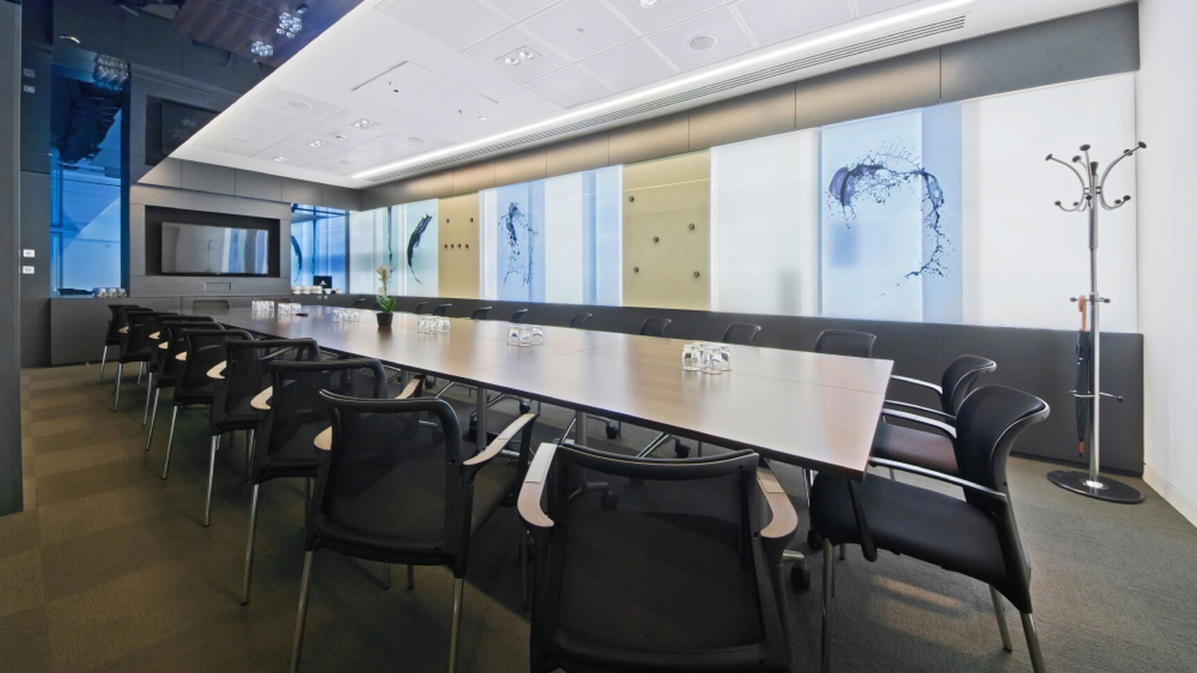 Twelve Elite Flip Top Rectangular Tables With Wood Finish And Silver Metal Leg Finish On Castors With Twenty Four Elite Chairs With Black Upholstery And Black Legs In Boardroom