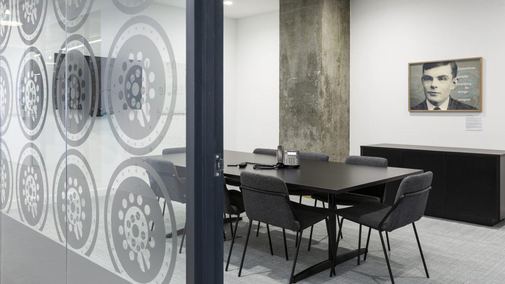 Workstories Sling Upholstered Side Chairs In Dark Grey Fabric At Meeting Table In Office Setting