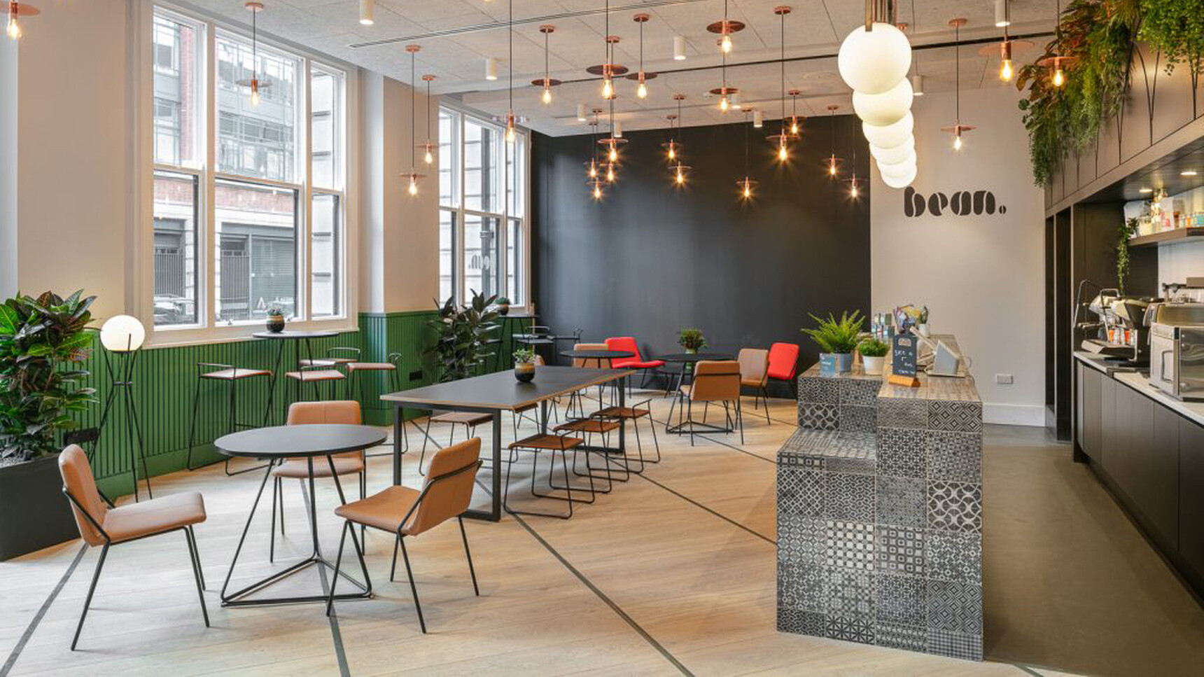 Workstories Sling Upholstered Side Chairs At Cafe Tables In Office Setting