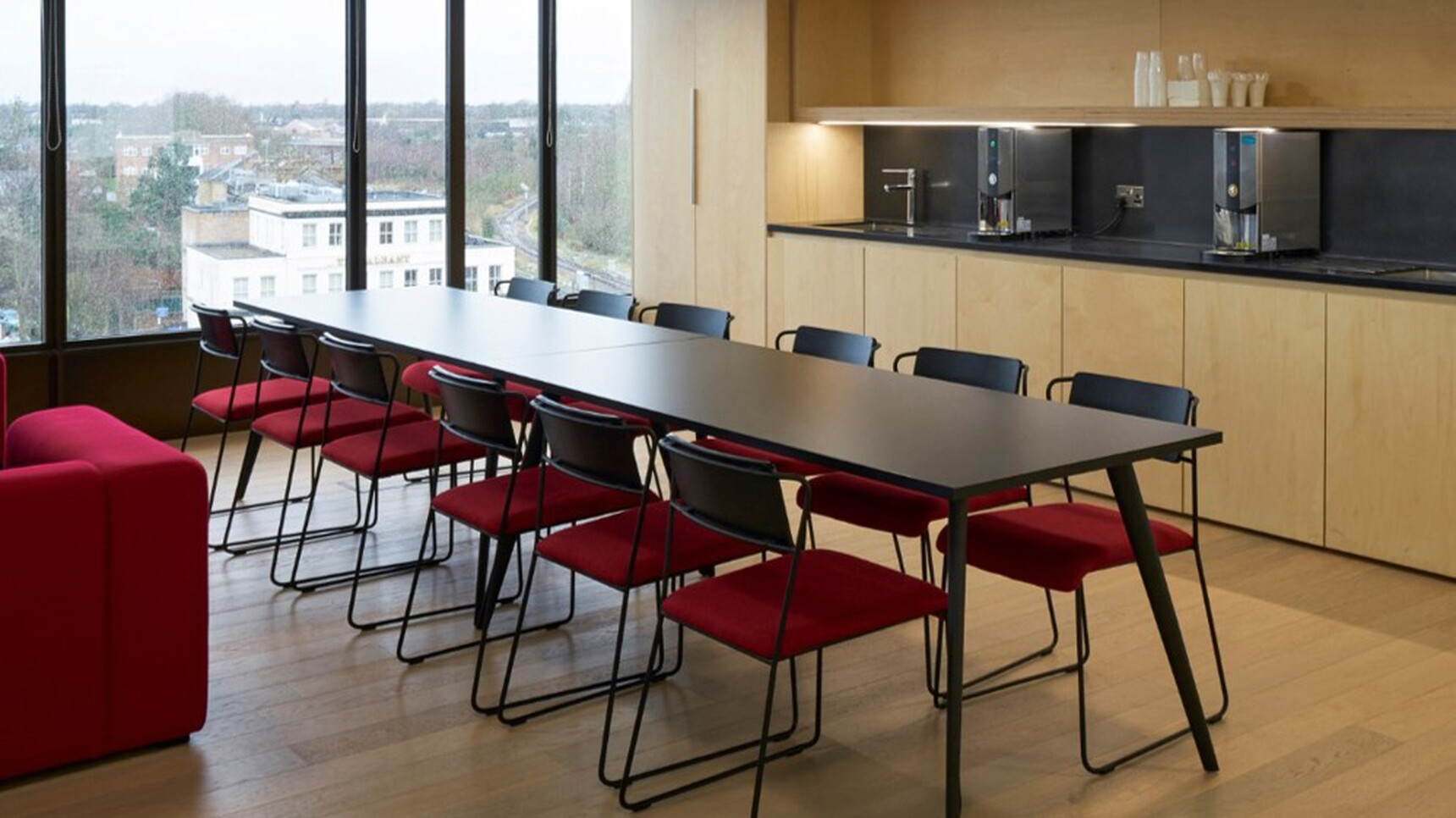 Workstories Transit Upholstered Café Chairs Red Seats Black Backrest In Office Setting