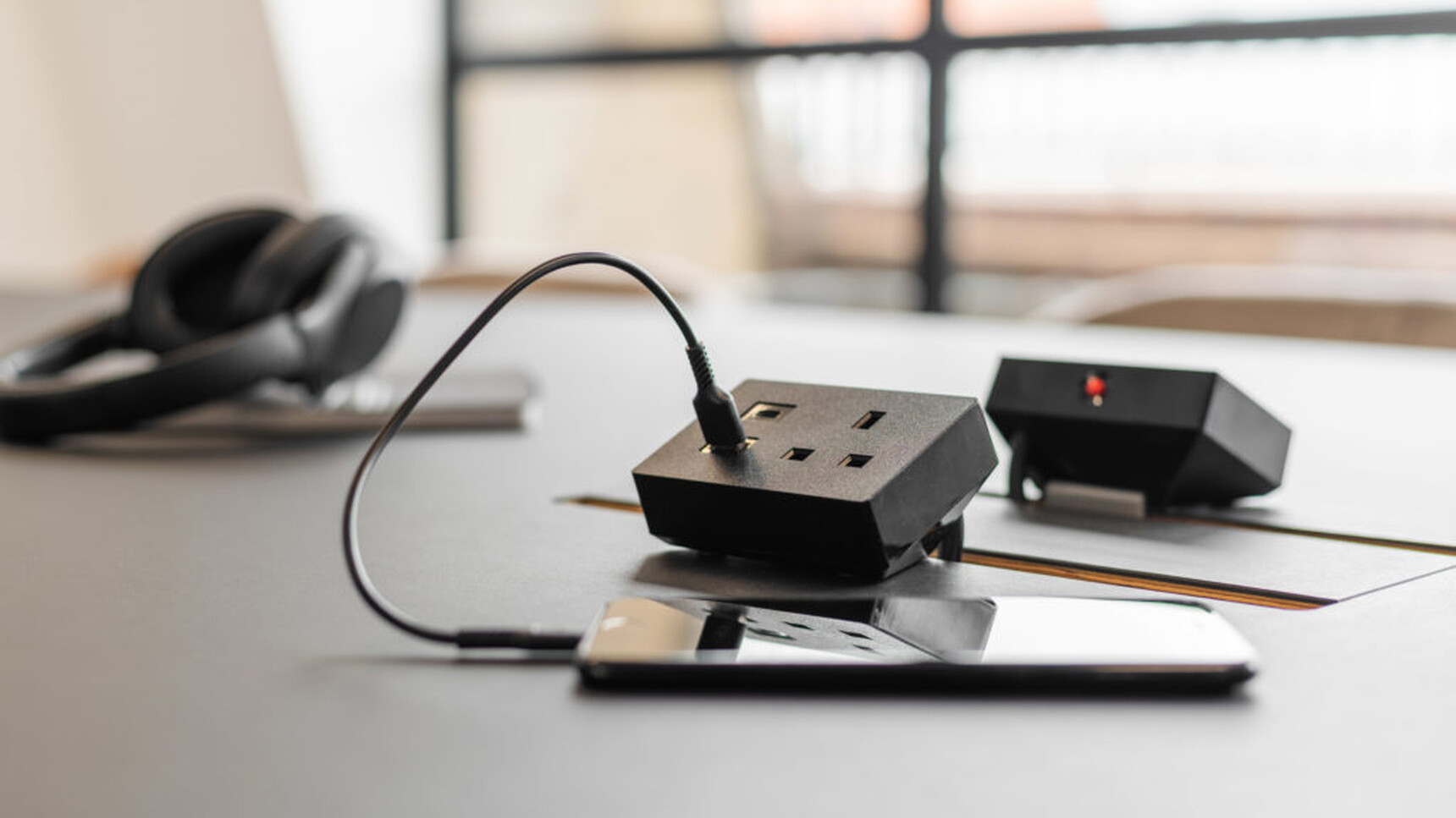 Workstories Nano Desktop Module Black Finish On Grey Desk With Phone Detail Image