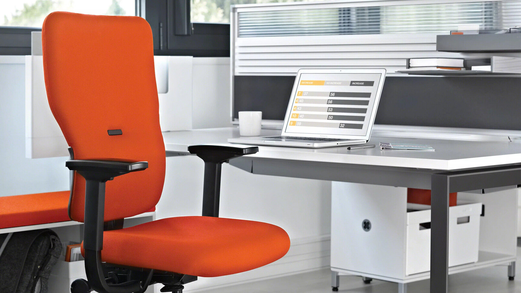Steelcase Let's B High Back Office Chair Orange Upholstery At Desk In Office Environment