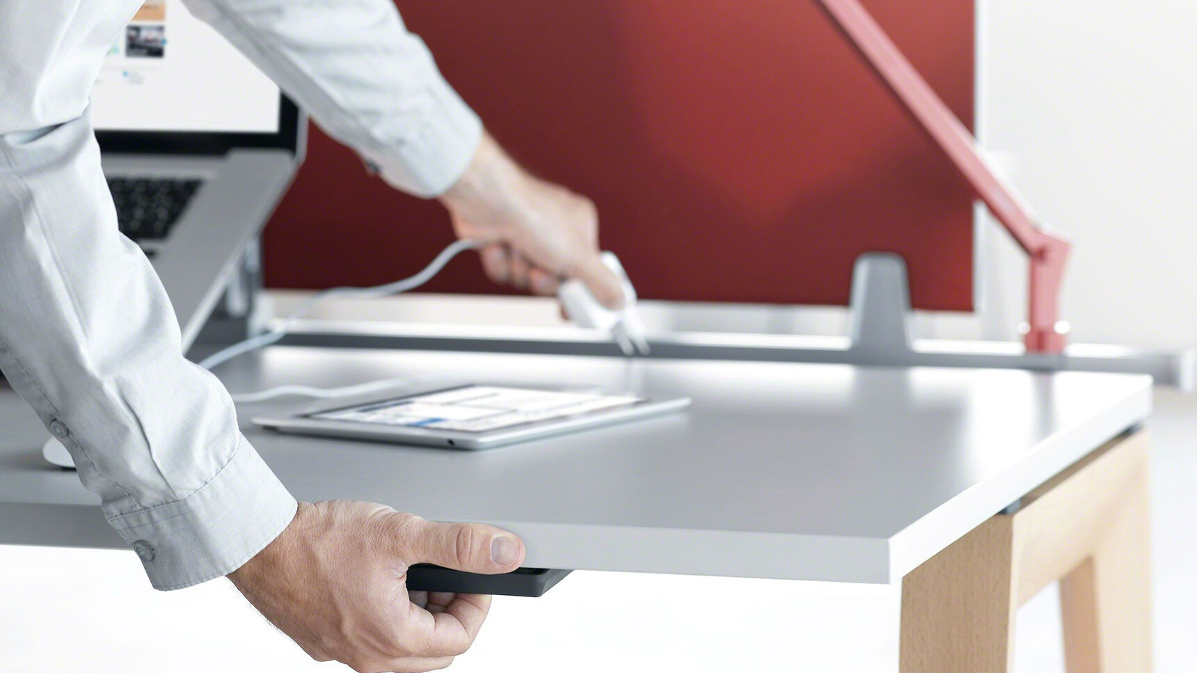 Steelcase B-Free Desk With White Table Top Finish And Wood Leg Finish With Desk In Use Detail Image