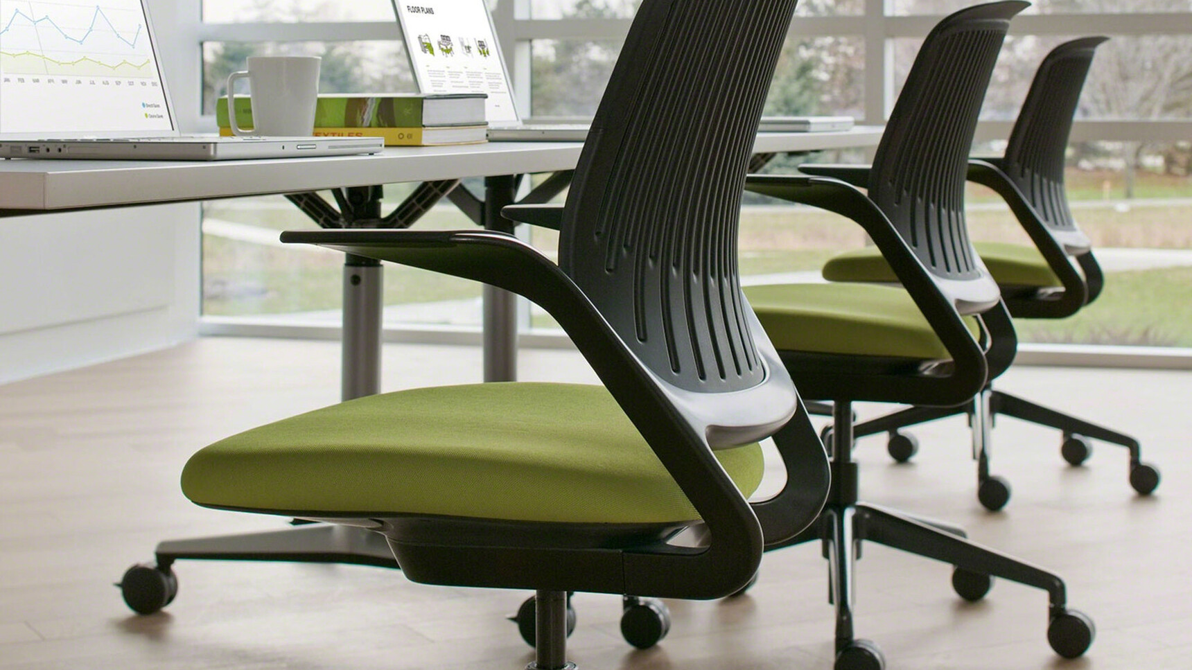 Three Steelcase Cobi Office Chairs With Black Frame And Green Upholstery And Black Base On Castors Detail Image