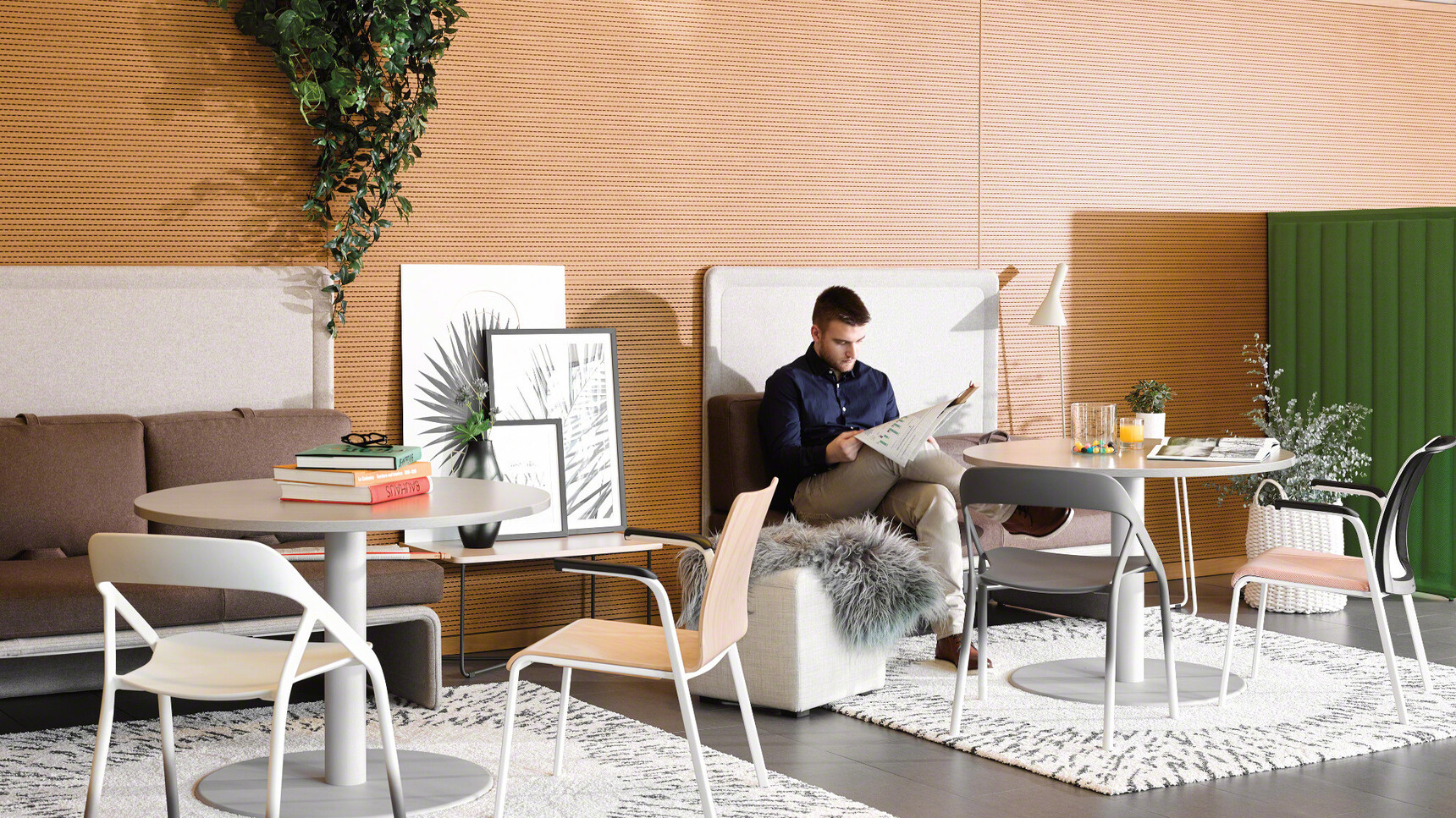 Two Steelcase Eastside Four Leg Base Meeting Chairs One With Wood Finish And White Legs One With White Mesh Backrest And Beige Upholstered Seat At Desks In Breakroom