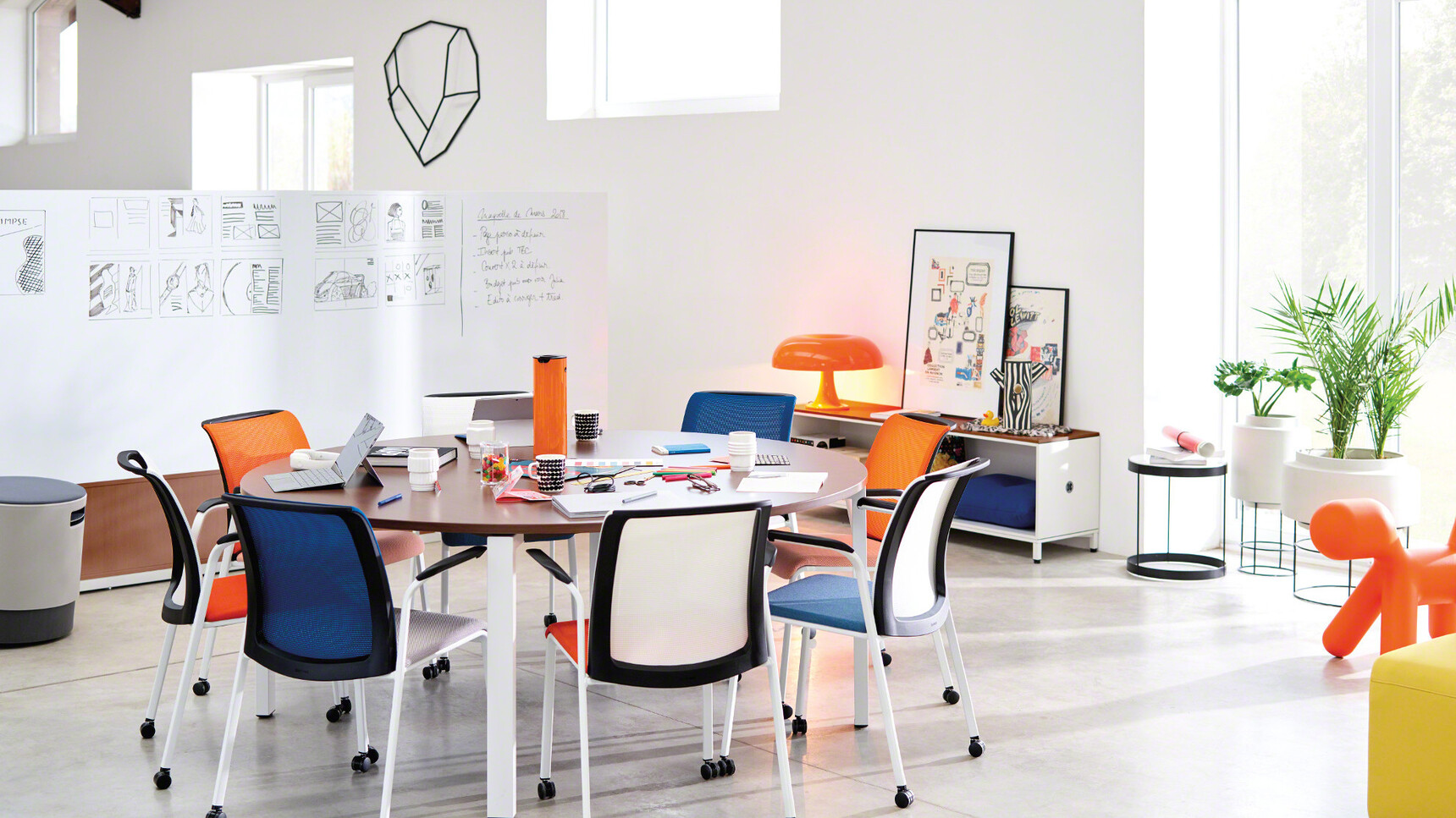 Eight Steelcase Eastside Four Leg Base Meeting Chairs In Orange And Blue Upholstery At Desk