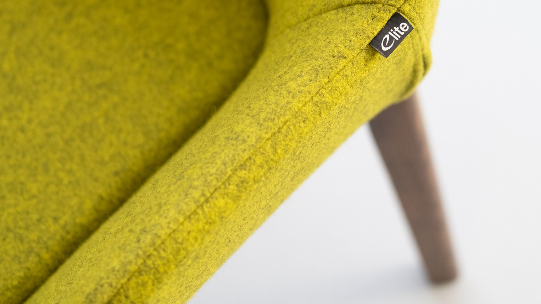 Elite Office Furniture Norden Meeting Chair With Four Leg Base Wood Base Green Yellow Upholstery Detail Image