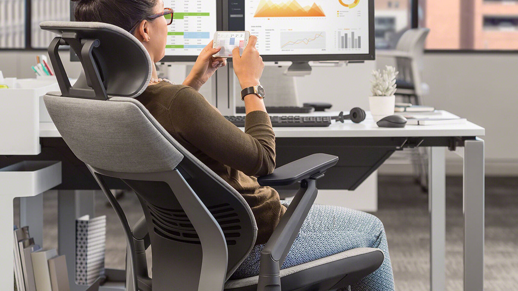 Steelcase Gesture Wrapped Back Office Chair with Headrest With Grey Upholstery At Frameone Desk Detail Image