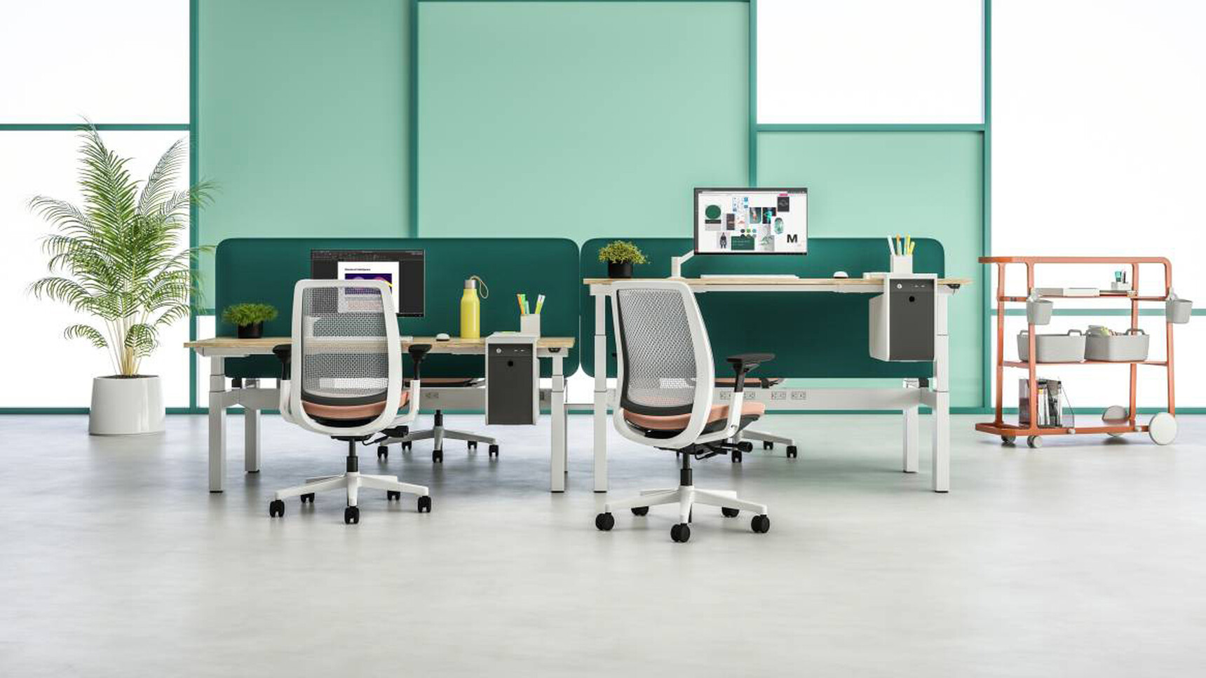 Two Steelcase Migration Height Adjustable Bench Desks With Wood Table Top Finish And Grey Base Finish And Four Steelcase Office Chairs With White Backrest And Light Orange Upholstery And White Legs On Castors
