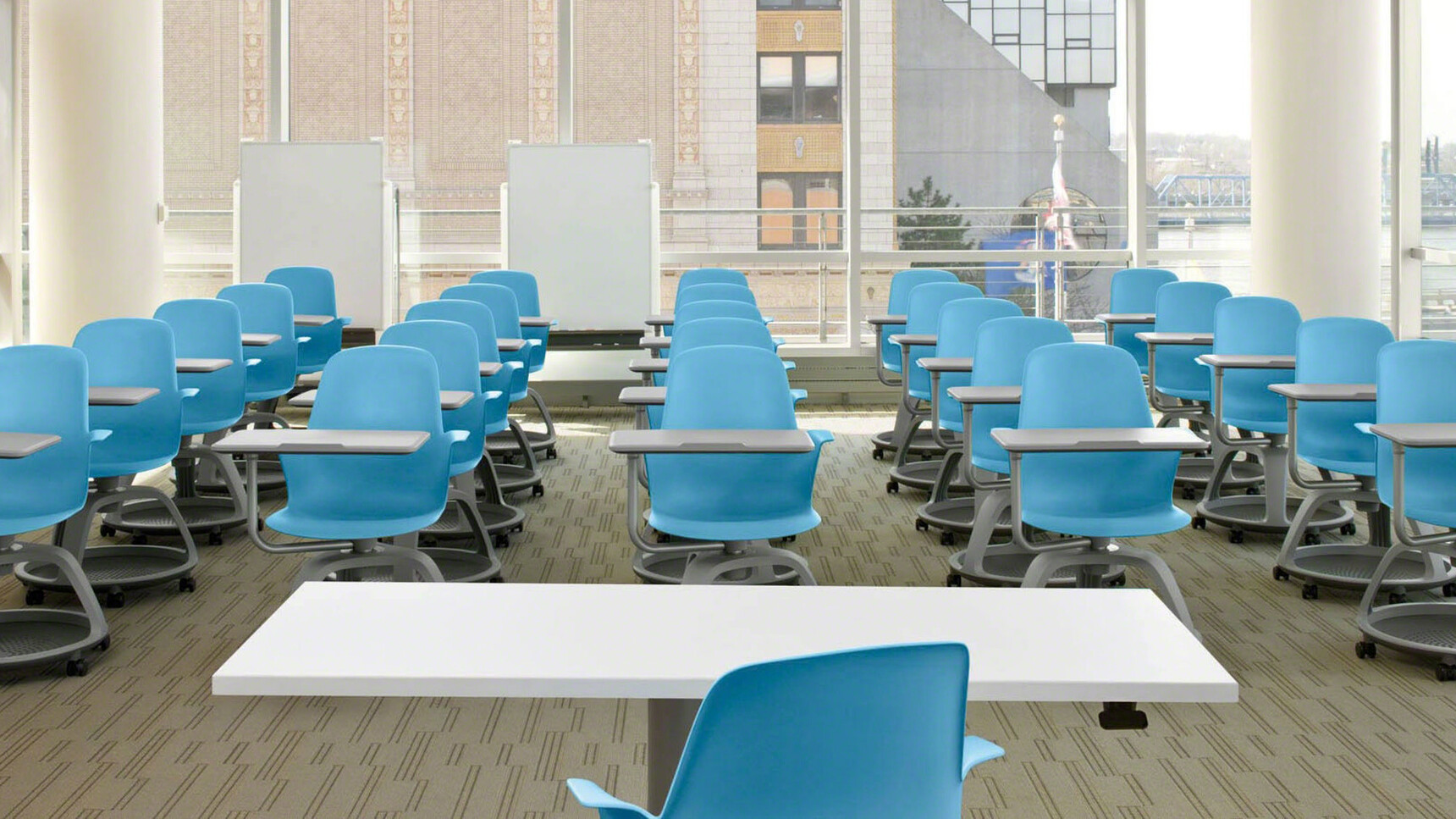 Various Steelcase Node Tripod Base Chairs With Table On Castors With Blue Finish In Educational Setting