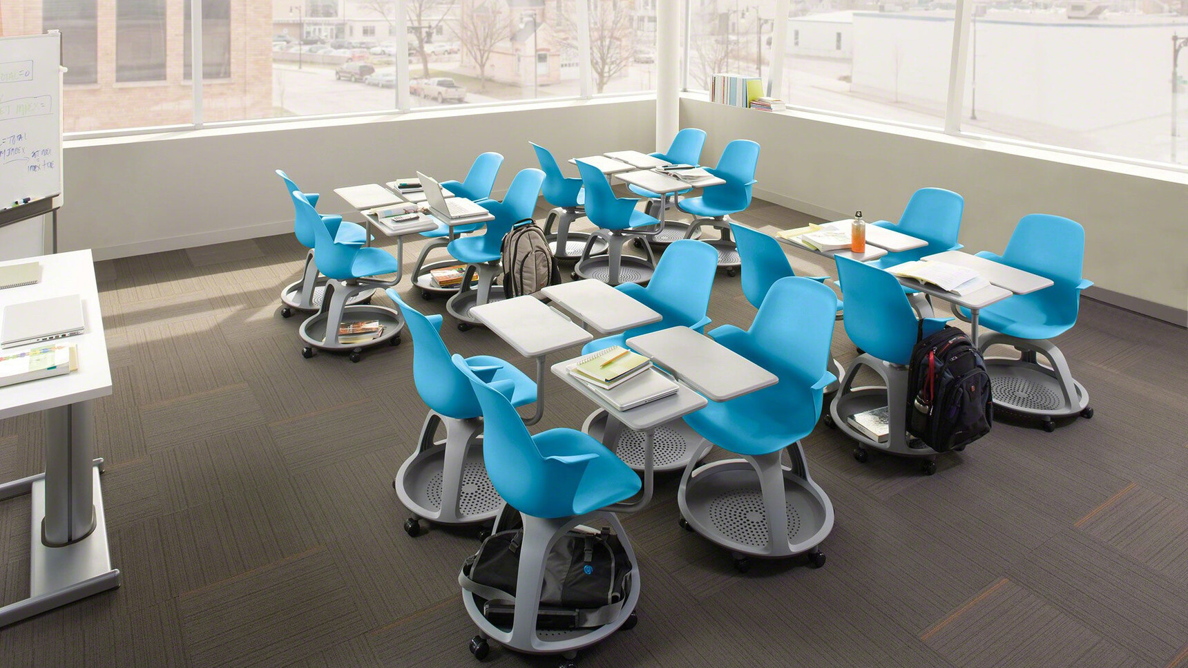 Sixteen Steelcase Node Tripod Base Chairs With Table On Castors With Blue Finish In Educational Setting
