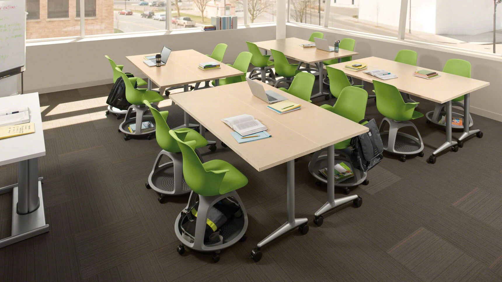 Sixteen Steelcase Node Tripod Base Chairs without Table With Plastic Back And Seat In Green Finish With Grey Base Finish In Educational Setting