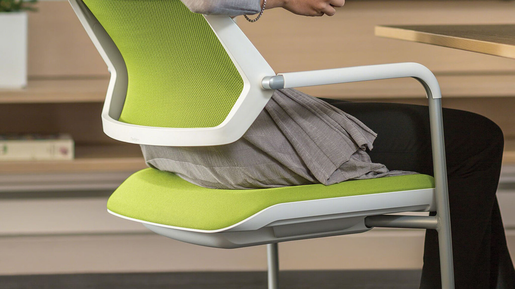 Steelcase Qivi Sled Base Conference Chair With White Frame And Green Upholstery And Platinum Base Finish Detail Image