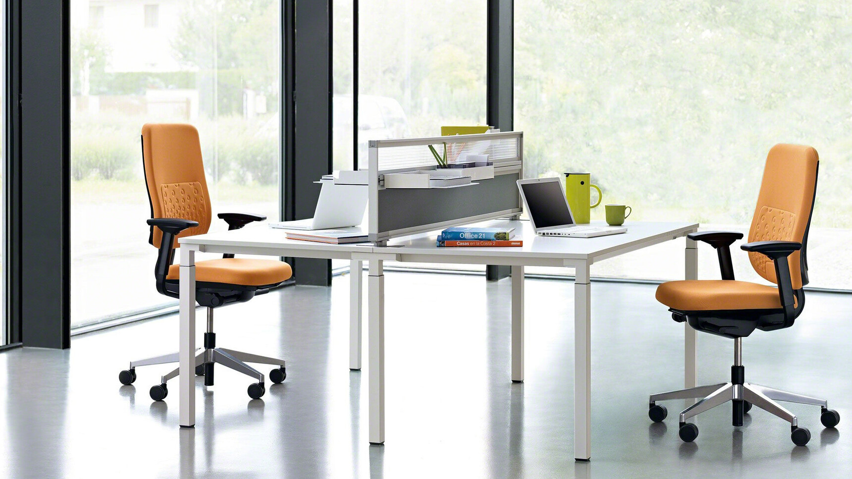 Two Steelcase Reply Upholstered Office Chairs With Orange Upholstery And Black Frame And Polished Aluminium Base On Castors At Steelcase Desk