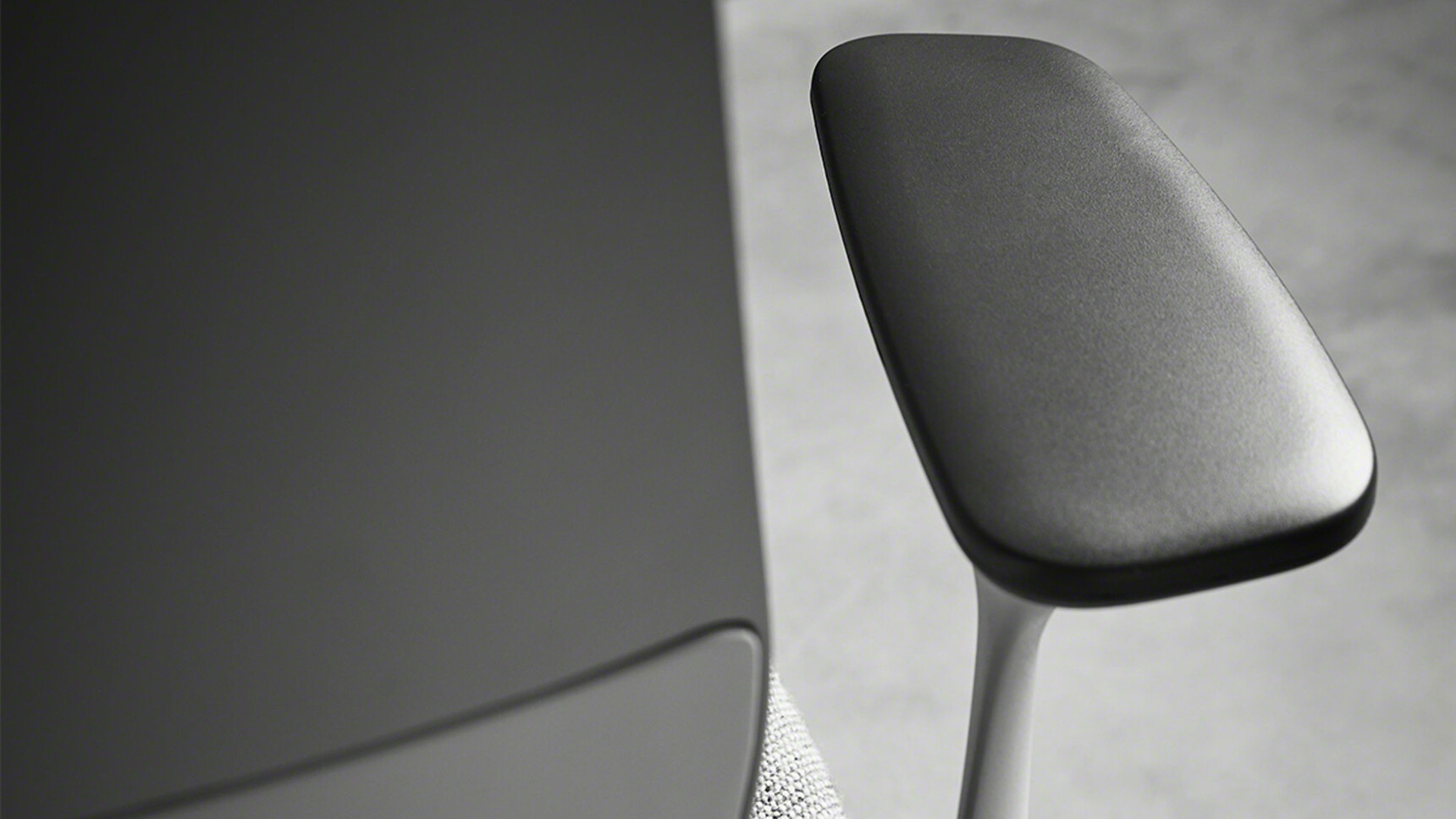 Steelcase SilQ Upholstered Draughtsman Office Chair With Grey Upholstery And White Frame And Black Arm Rest Focusing On Armrest Detail Image