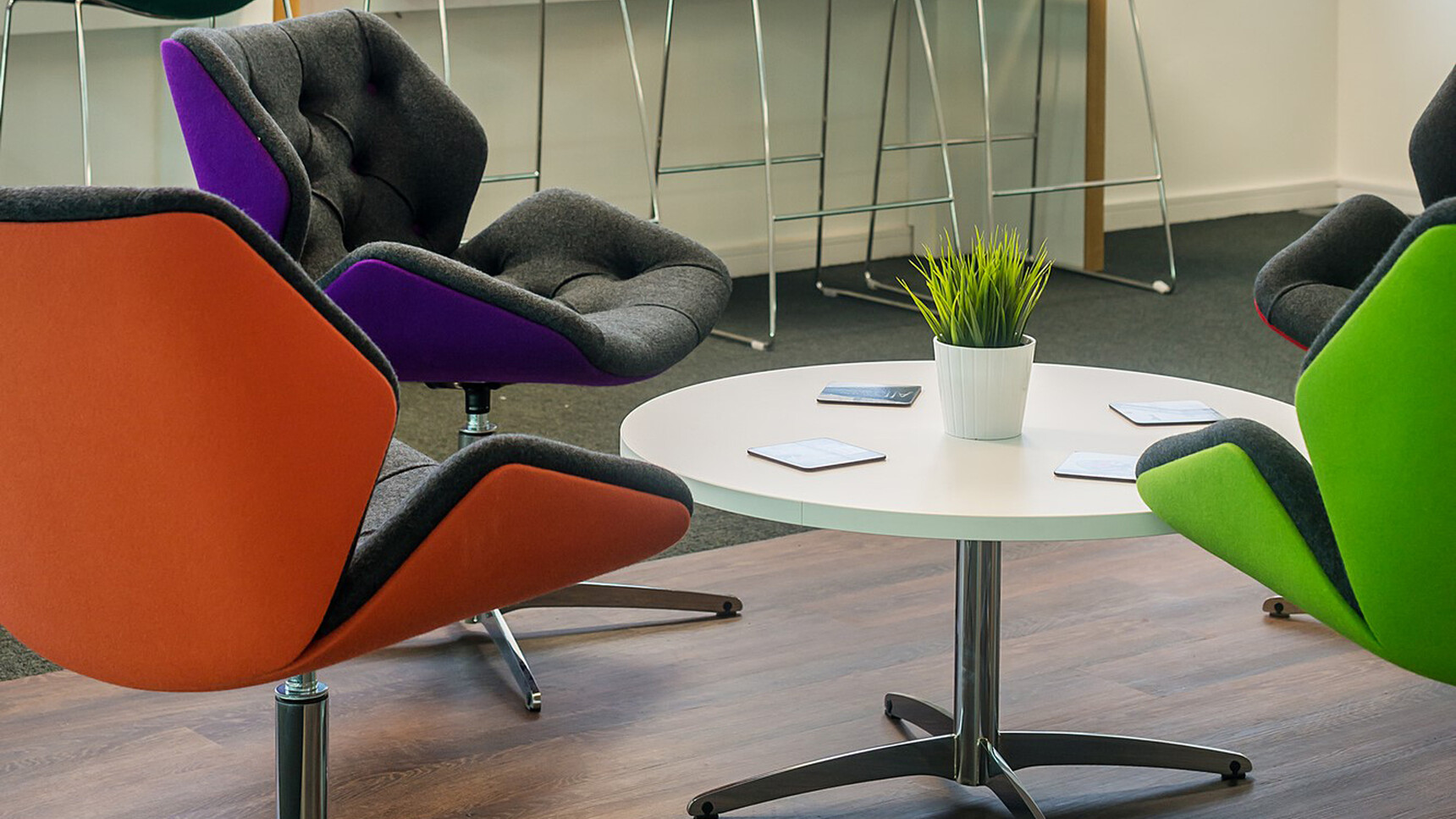 Four Elite Office Furniture Cascara Medium Back Lounge Chairs With Chrome Swivel Base Family Image