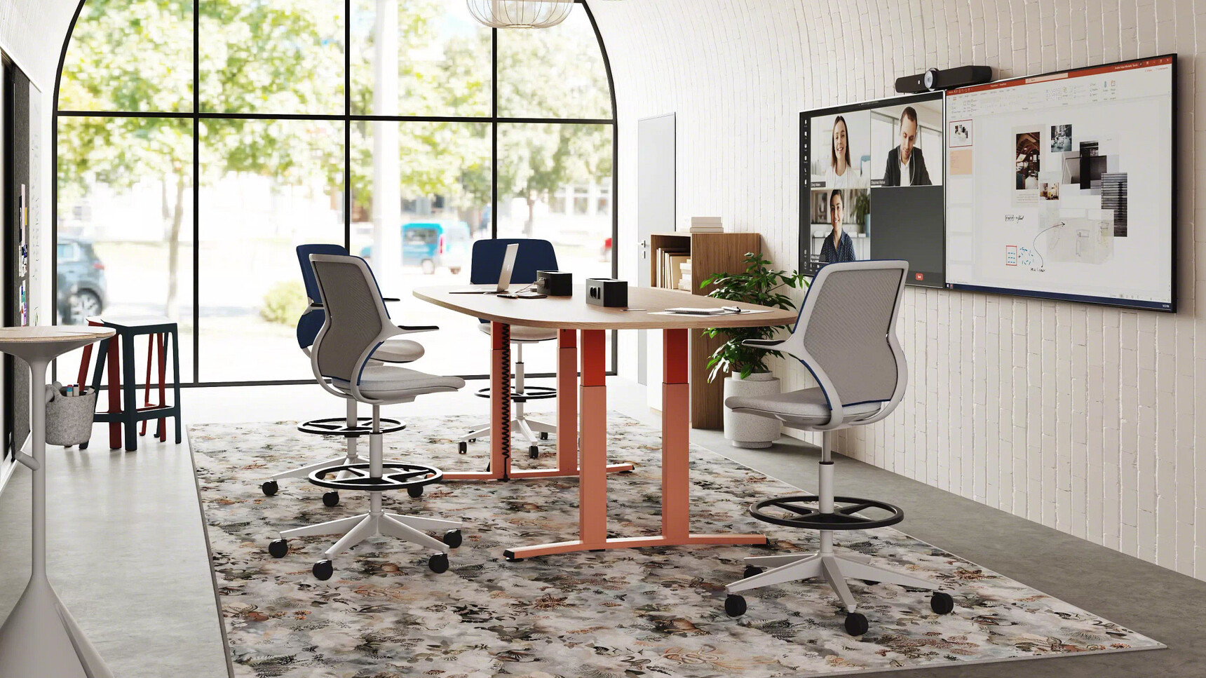 Steelcase Migration SE Height-Adjustable Meeting Table With 4-Leg Orange Finish With Draughtsman Stools In Office Setting