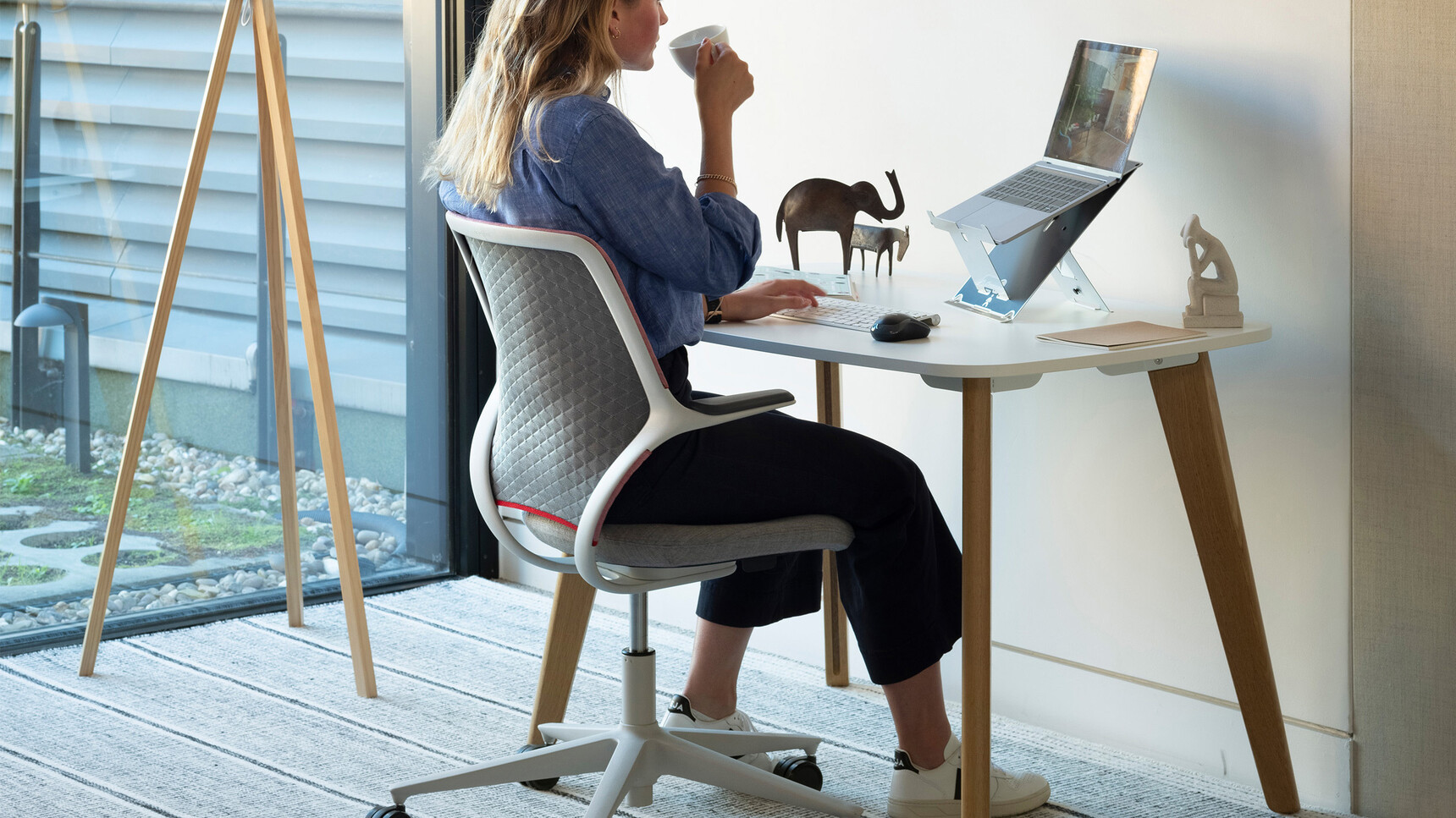 Orangebox AllowMe Midback Standard Height Office Chair At Fixed Height Table In Office Environment