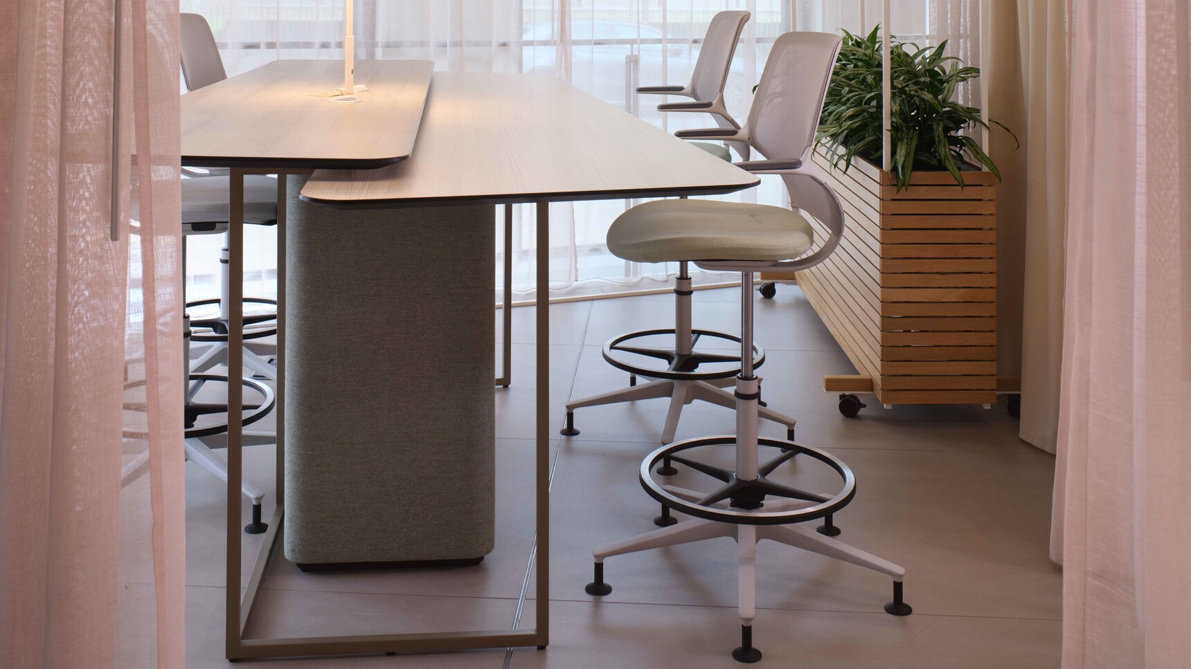 Orangebox AllowMe Midback Counter Height Office Chairs At Table In Office Setting
