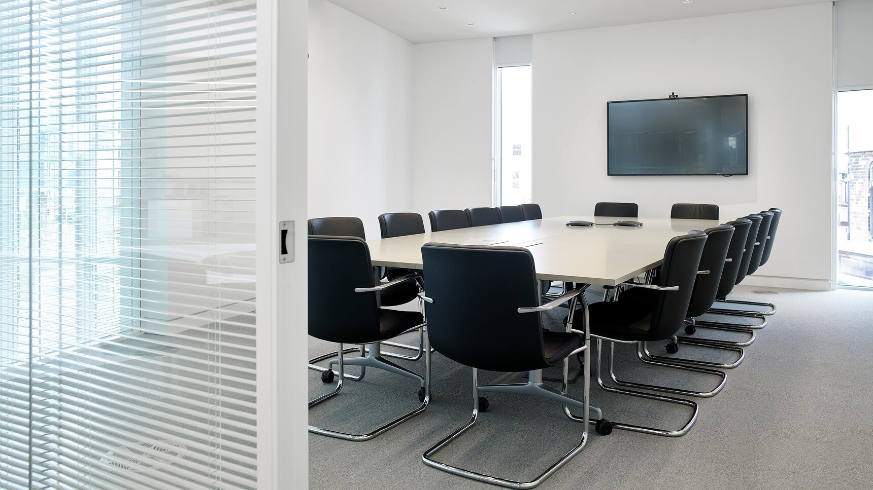 Orangebox Calder Midback Cantilever Chairs At Meeting Table In Office Setting