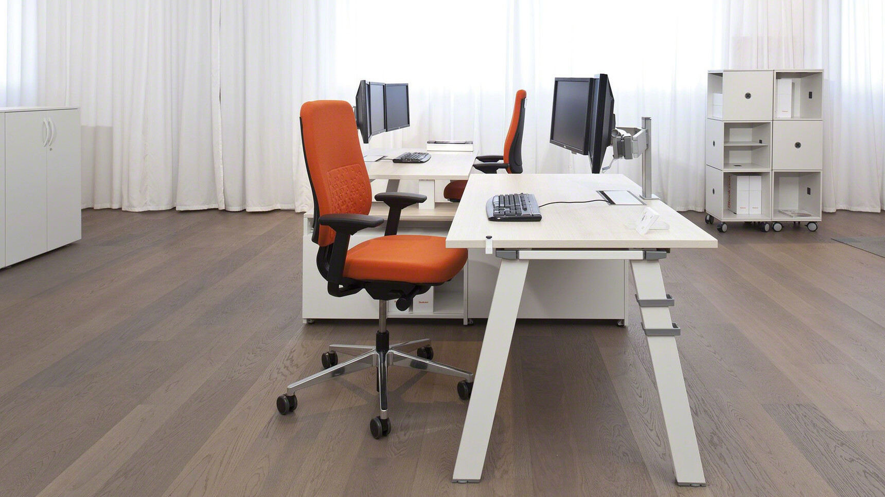 Two Steelcase Reply Upholstered Office Chairs Chrome Base Black Fixed Arms Orange Upholstery Black Frame At B-Free Desks Wood Finish White Leg Finish