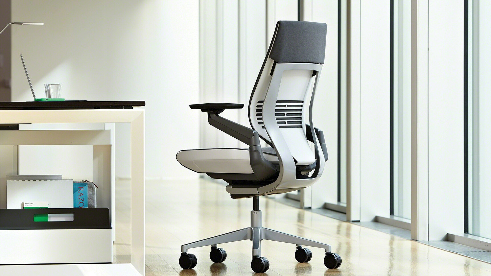 Steelcase Gesture Wrapped Back Office Chair In Black  Upholstery And White Grey Frame With Black Arms And Polished Aluminium Base Finish On Castors At Desk
