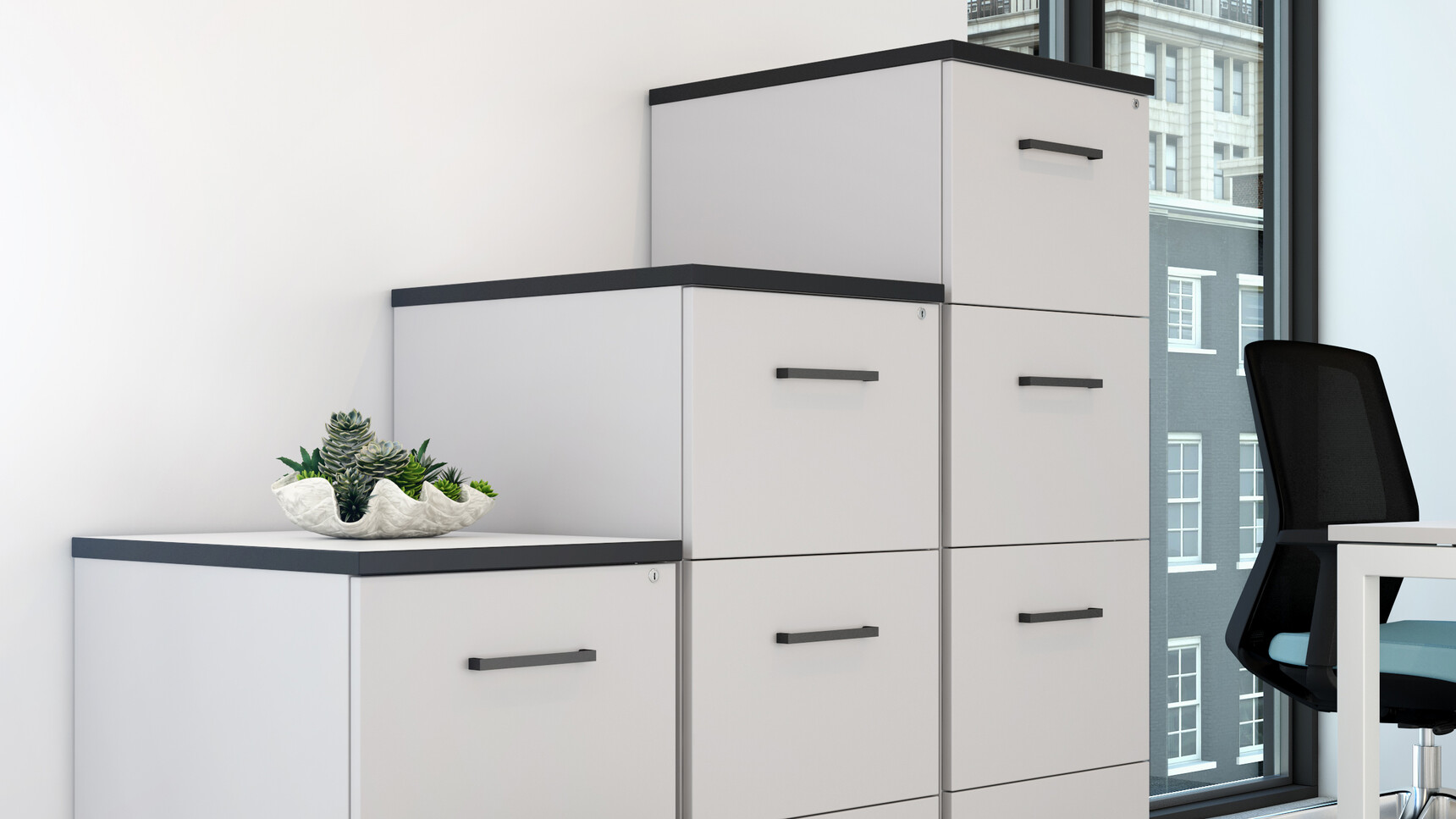One Four Drawer Filing Cabinet And One Three Drawer Filing Cabinet And One Two Drawer Filing Cabinet With Grey Finish And One Blue Vida Mesh Back Office Chair At Desk In Office Environment