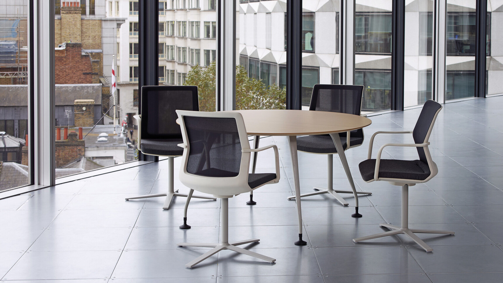 Orangebox Pars Round Meeting Table In Office Setting