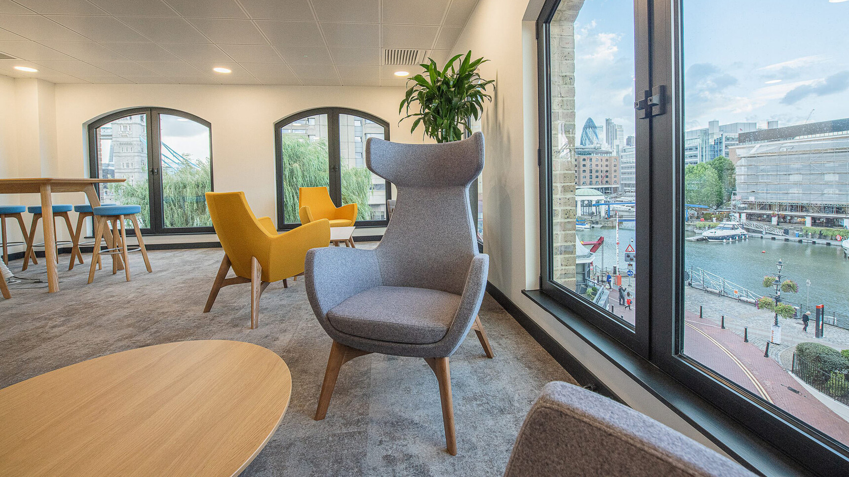 Connection Mae High Back Lounge Armchair With Four Leg Base In Lounge Setting