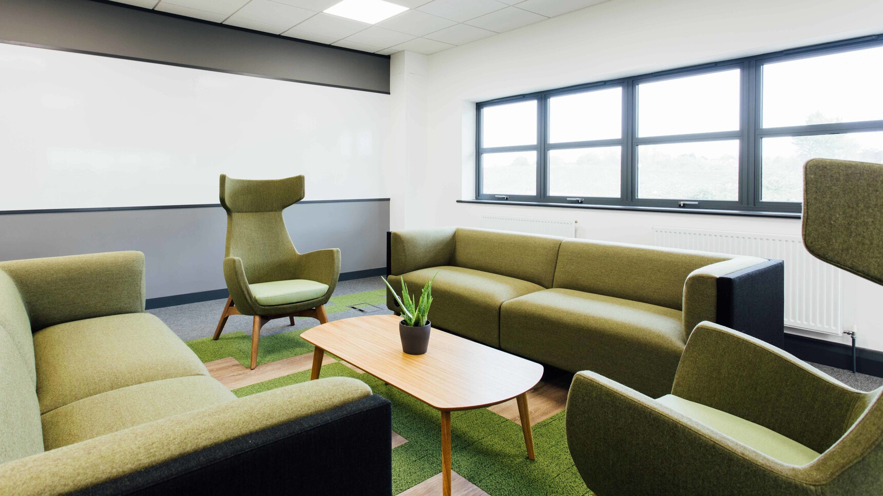 Connection Mae High Back Lounge Armchair With Four Leg Base With Sofas In Office Setting