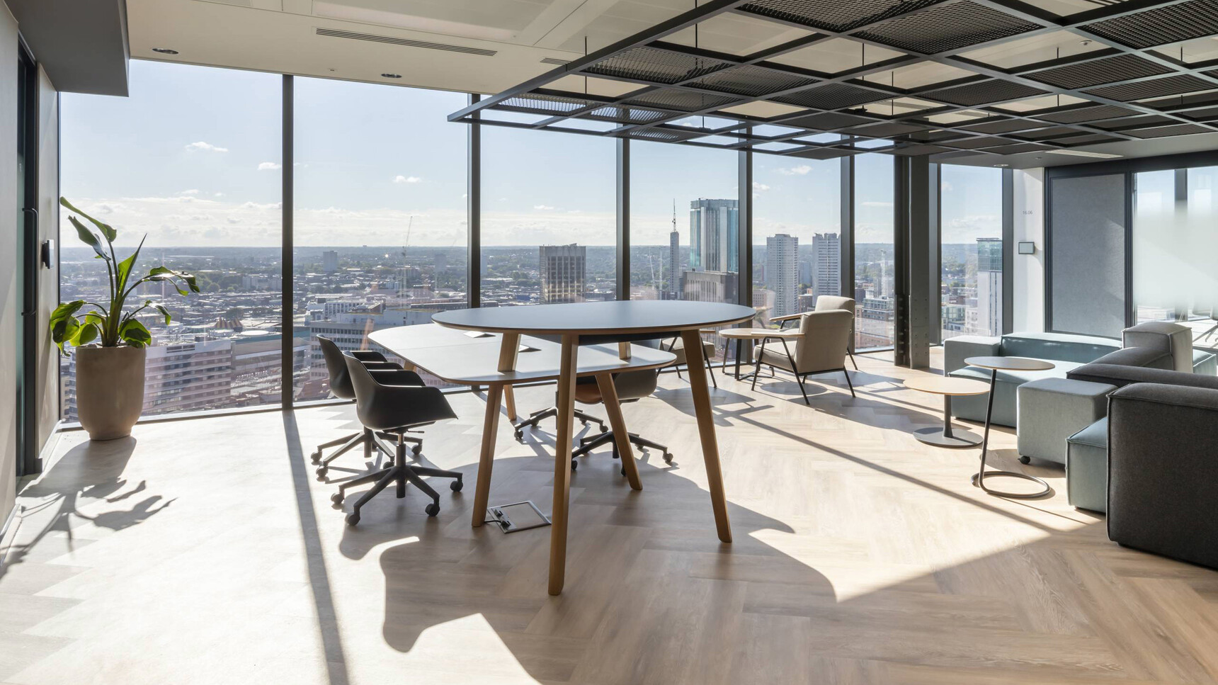 Connection Co. Table Poseur Height Table With Chairs At Table In Office Setting