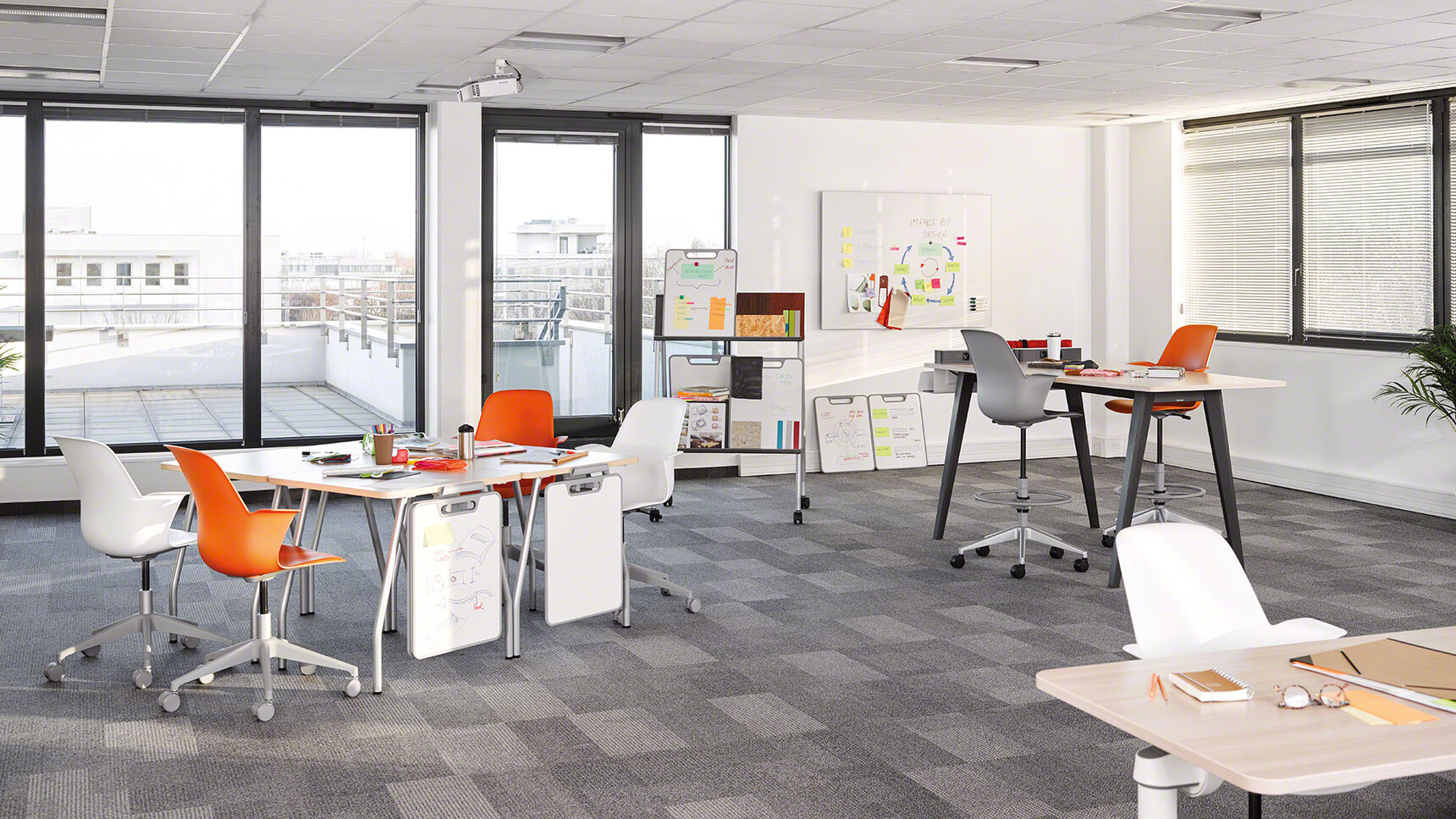 Two Node 5 Star Base Draughtsman Stools With Plastic Back And Seat One In Orange And One In Grey At Desks Four Node 5 Star Base Chairs In Orange And White