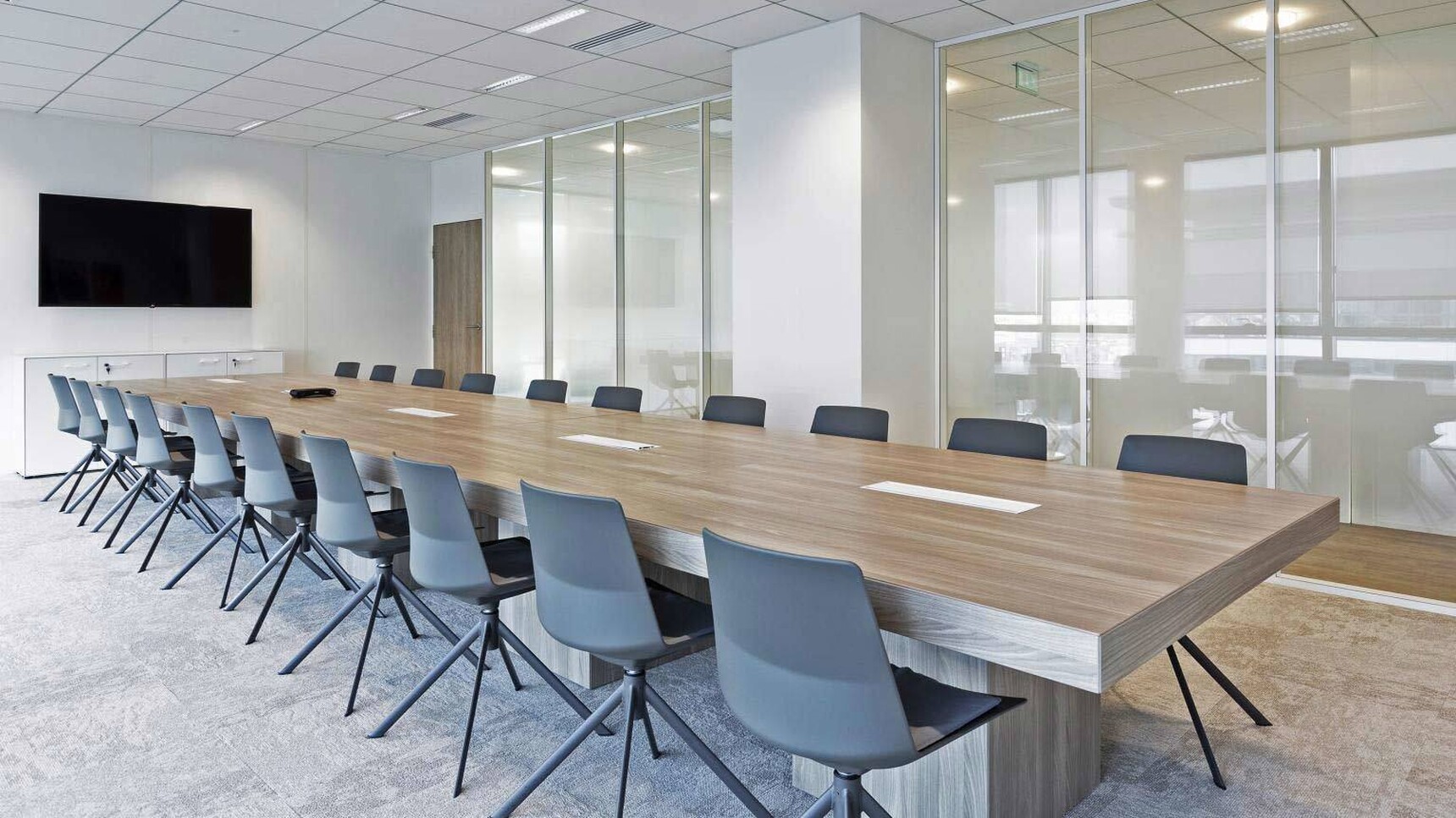 Quadrifoglio T45 Four Section Boardroom Table With Melamine Cubed Legs In Office Setting