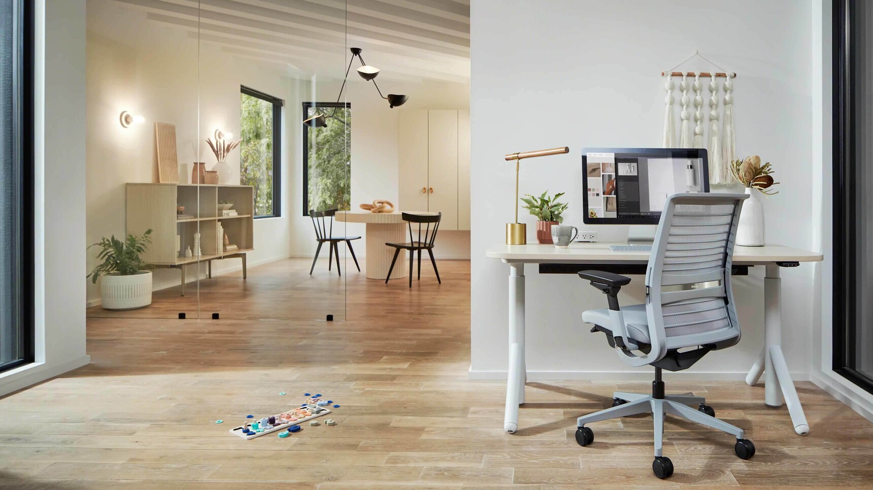 Steelcase Think V2 3D Knit Back Office Chair Home Edition At Flex Height Adjustable Desk In Home Setting