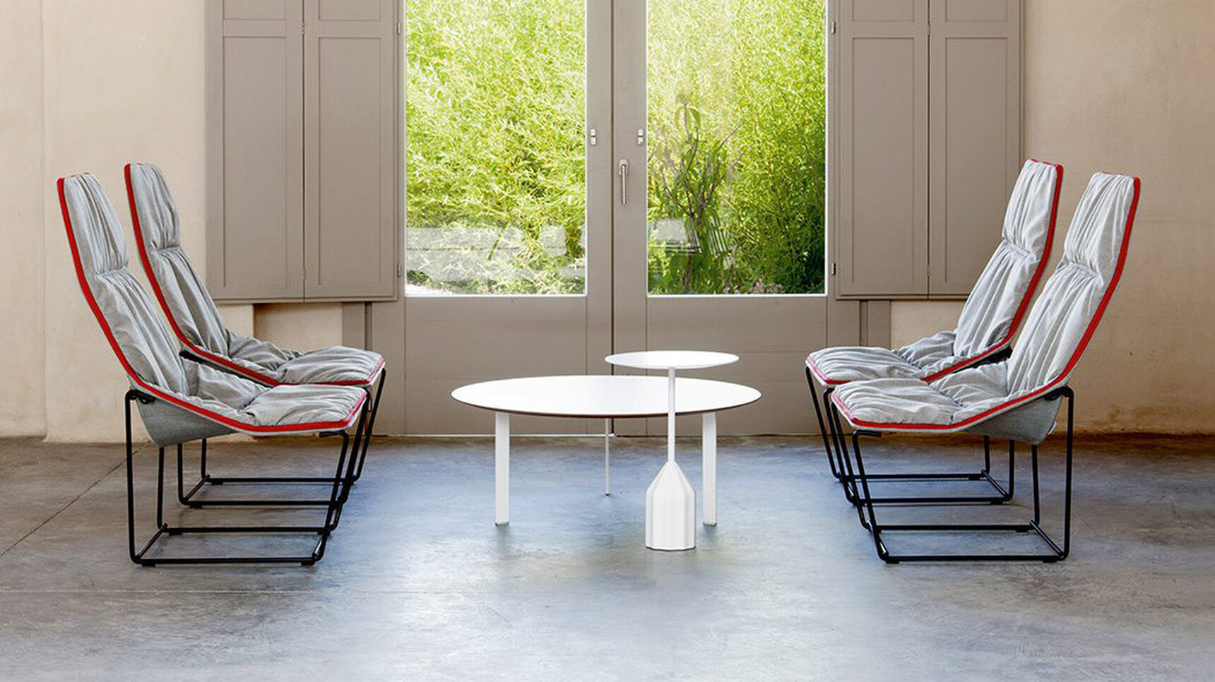 Viccarbe Burin Circular Mini Side Table White Finish With Four Chairs In Lounge Setting